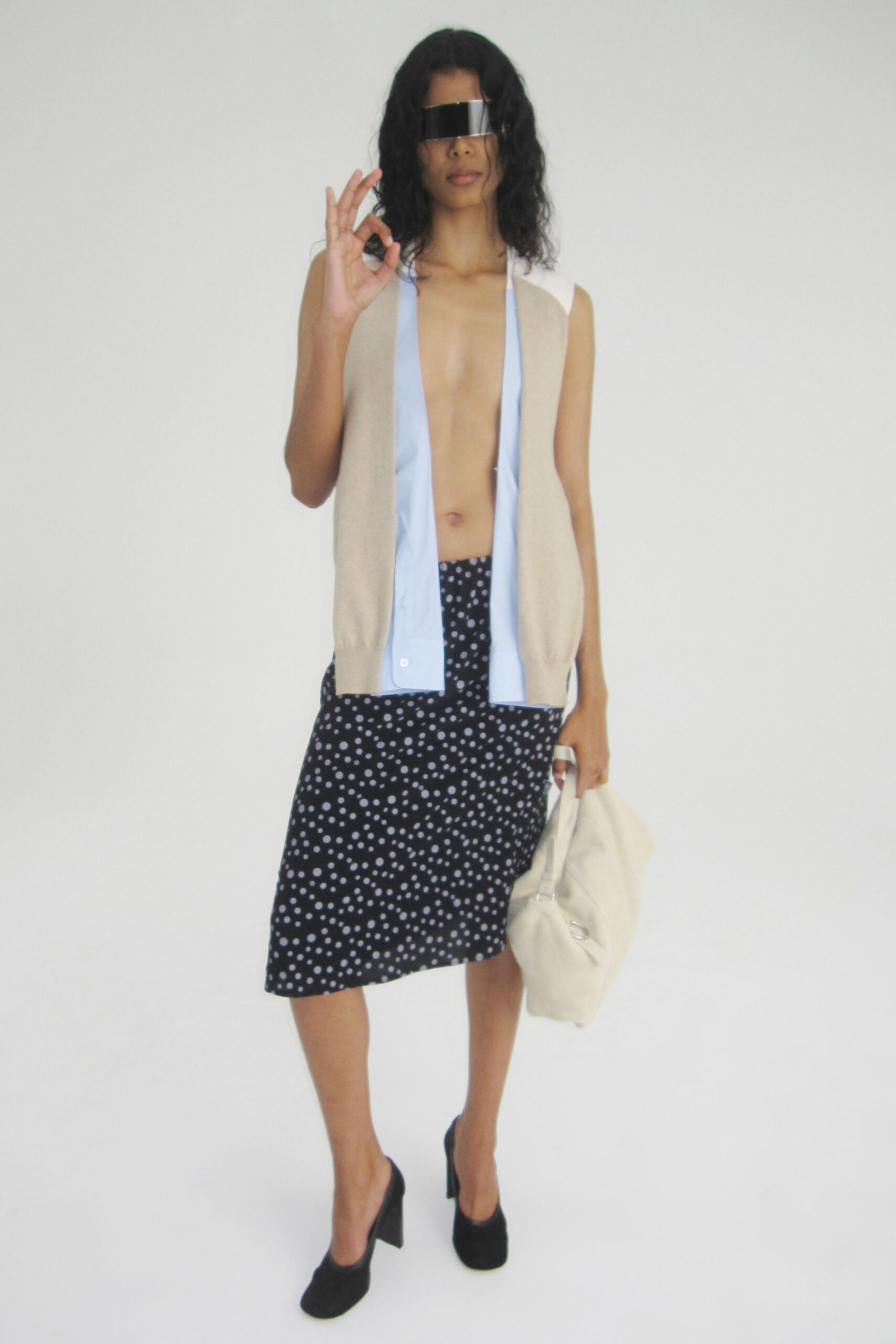 beige cotton sleeveless fitted vest