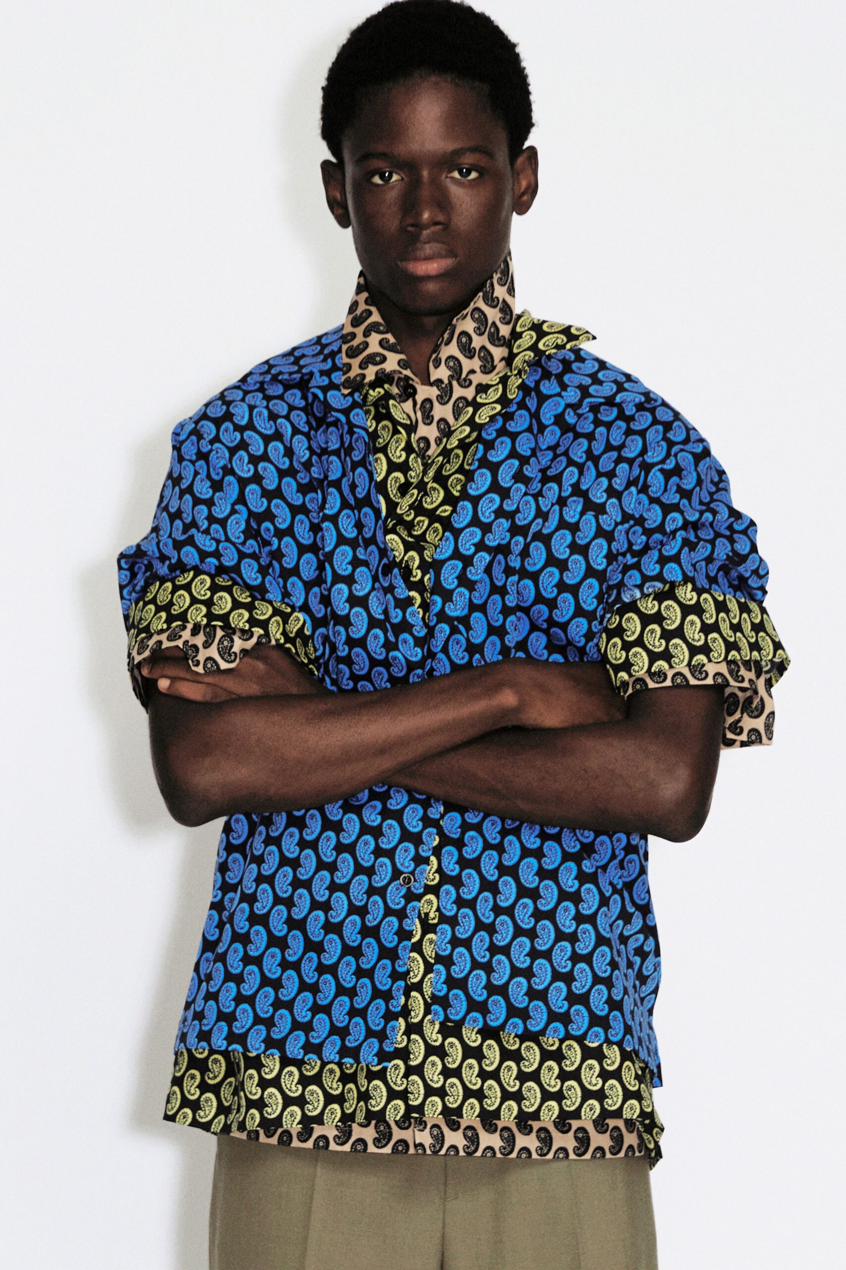 printed blue shirt with beige pants