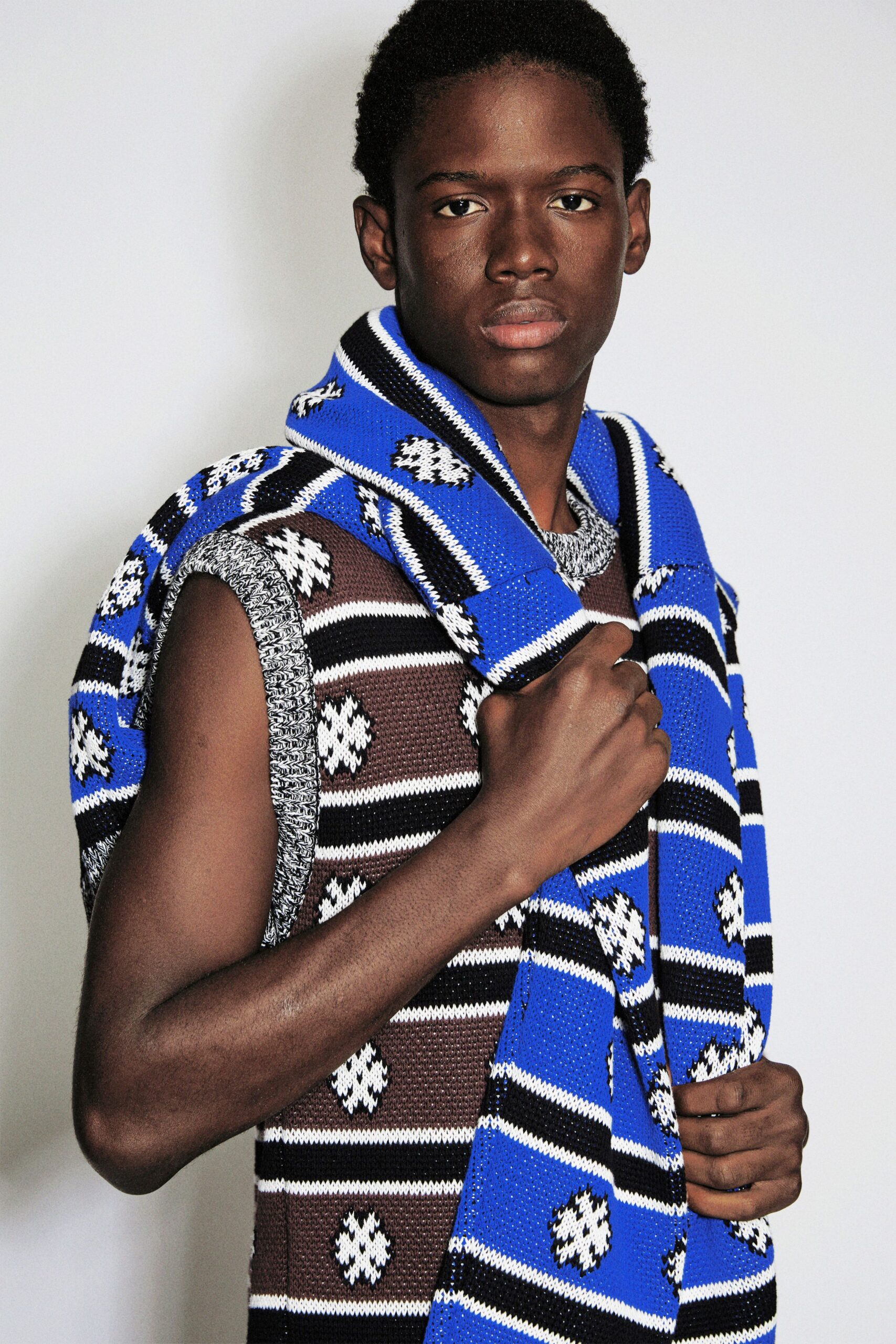 brown gray striped sweater with blue scarf
