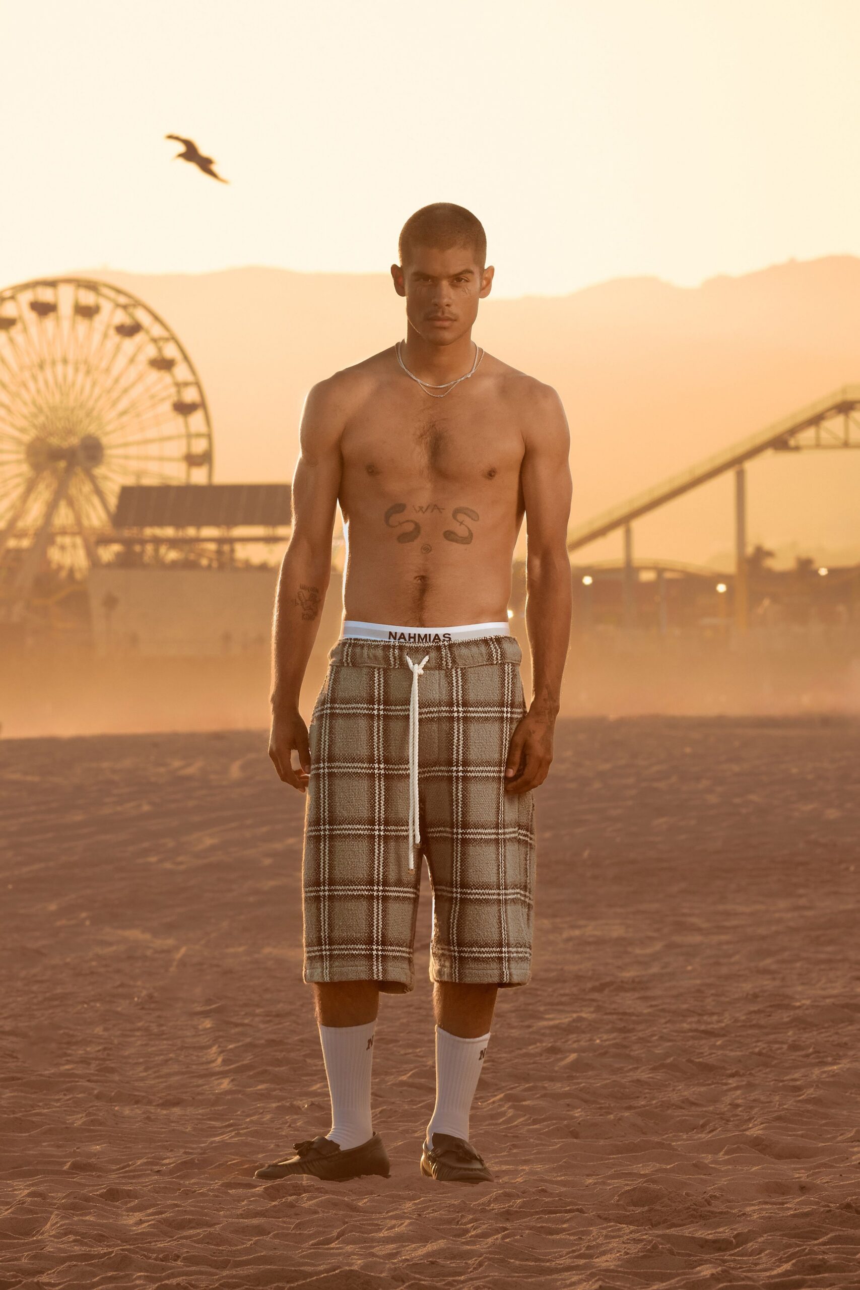 beige checked shorts with black shoes