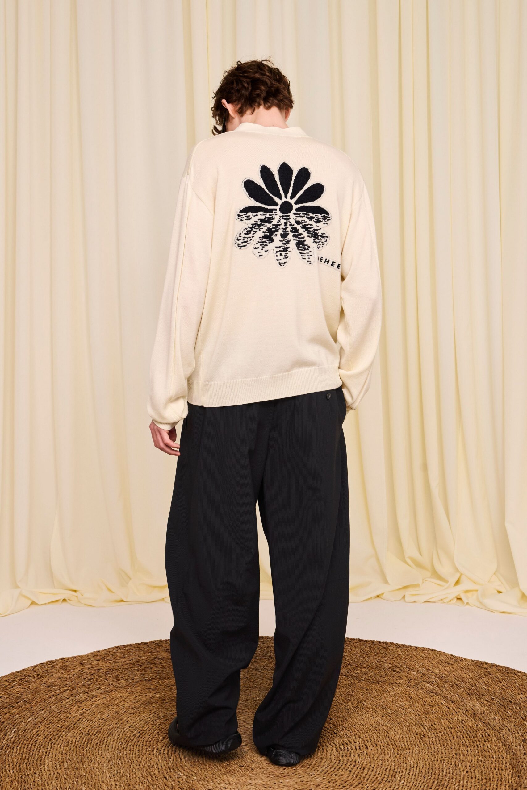 beige relaxed sweater with black pants