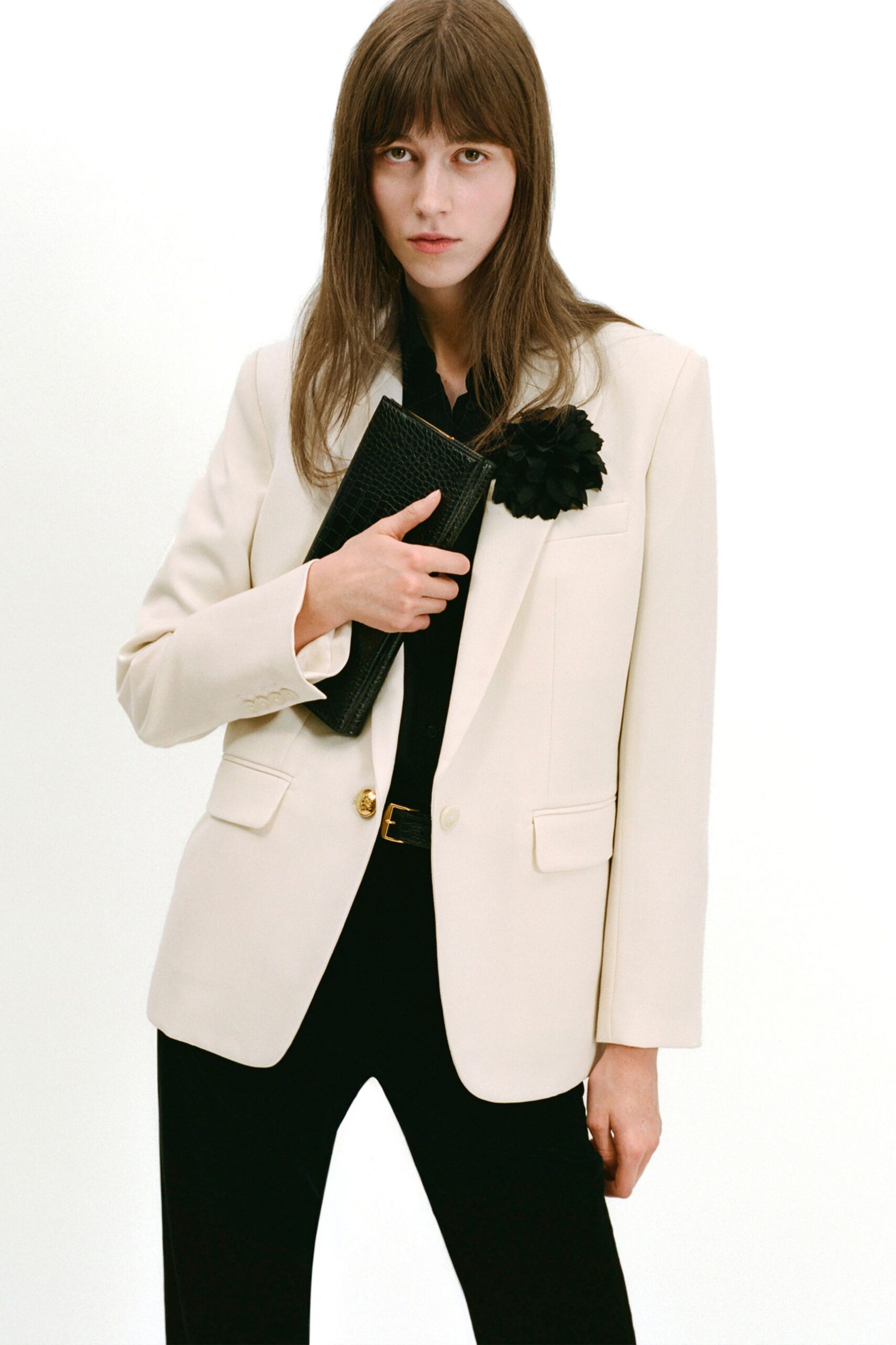white tailored blazer with black pants
