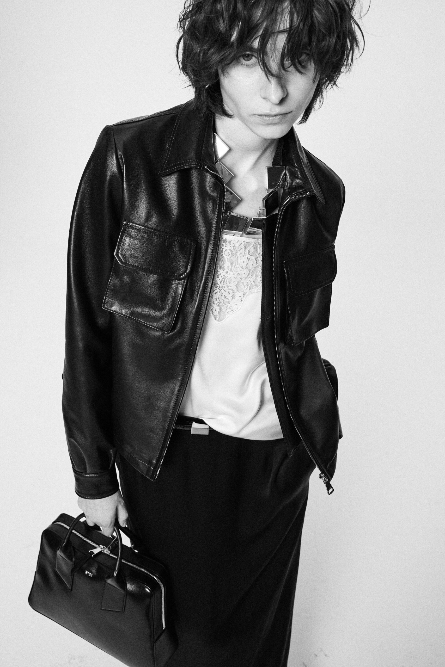 black leather long-sleeve collared fitted zippered pockets jacket