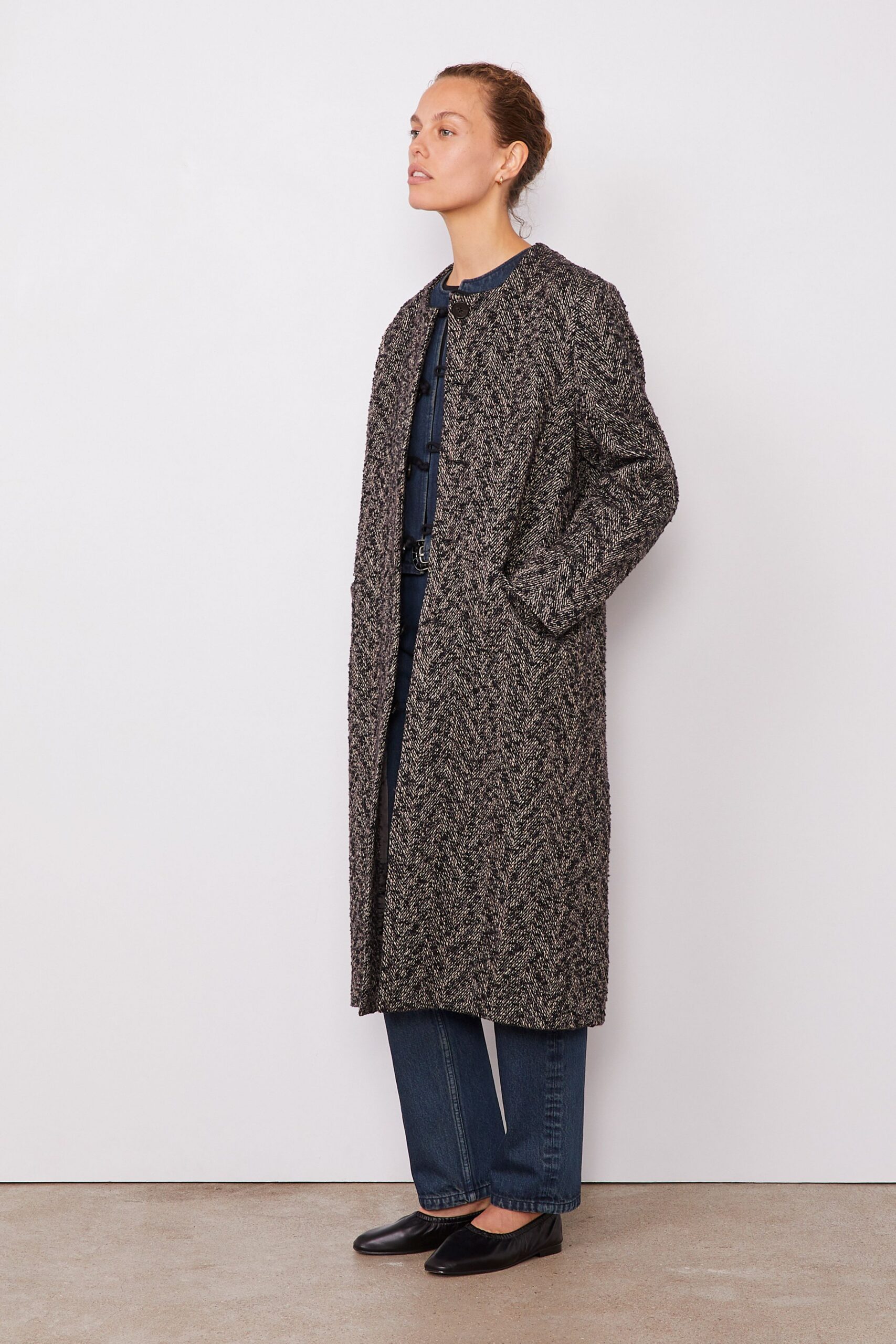 black wool long-sleeve collared relaxed textured maxi coat
