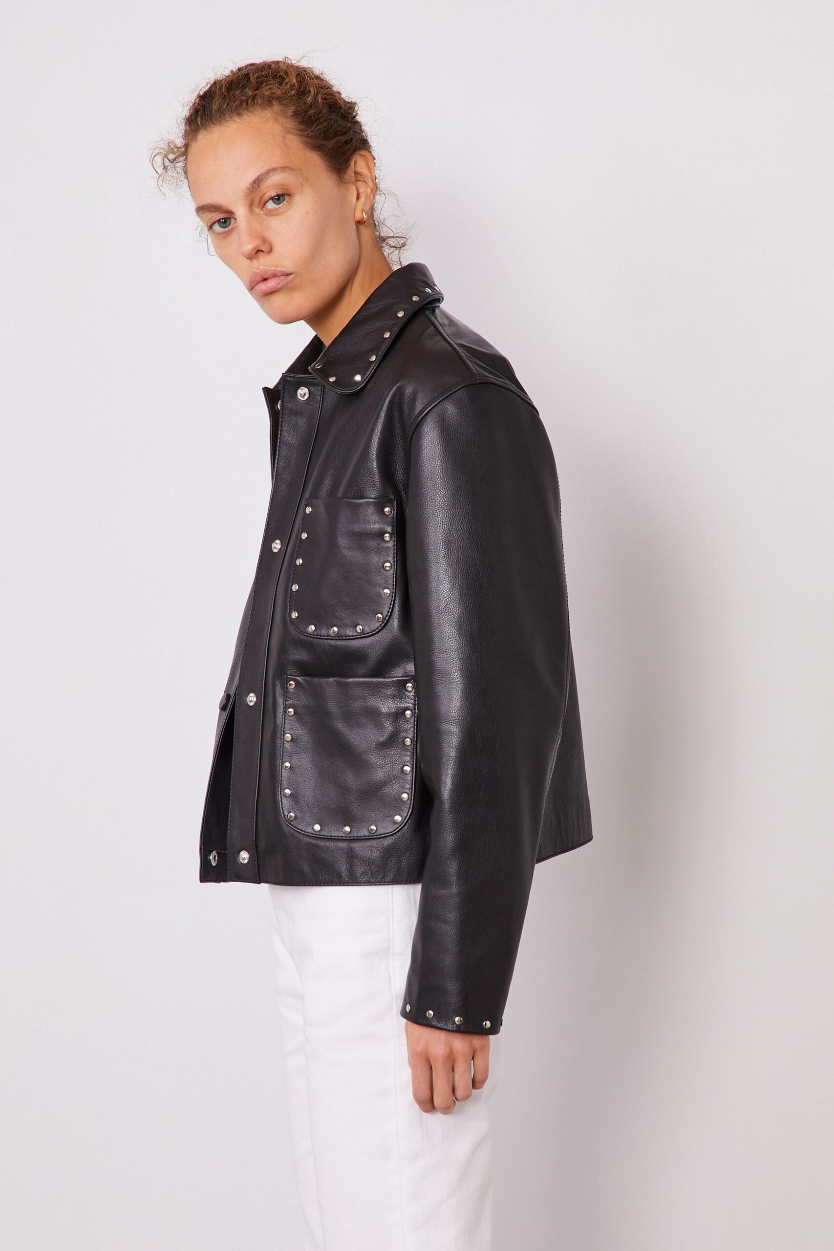 black leather long-sleeve collared fitted buttoned pockets jacket