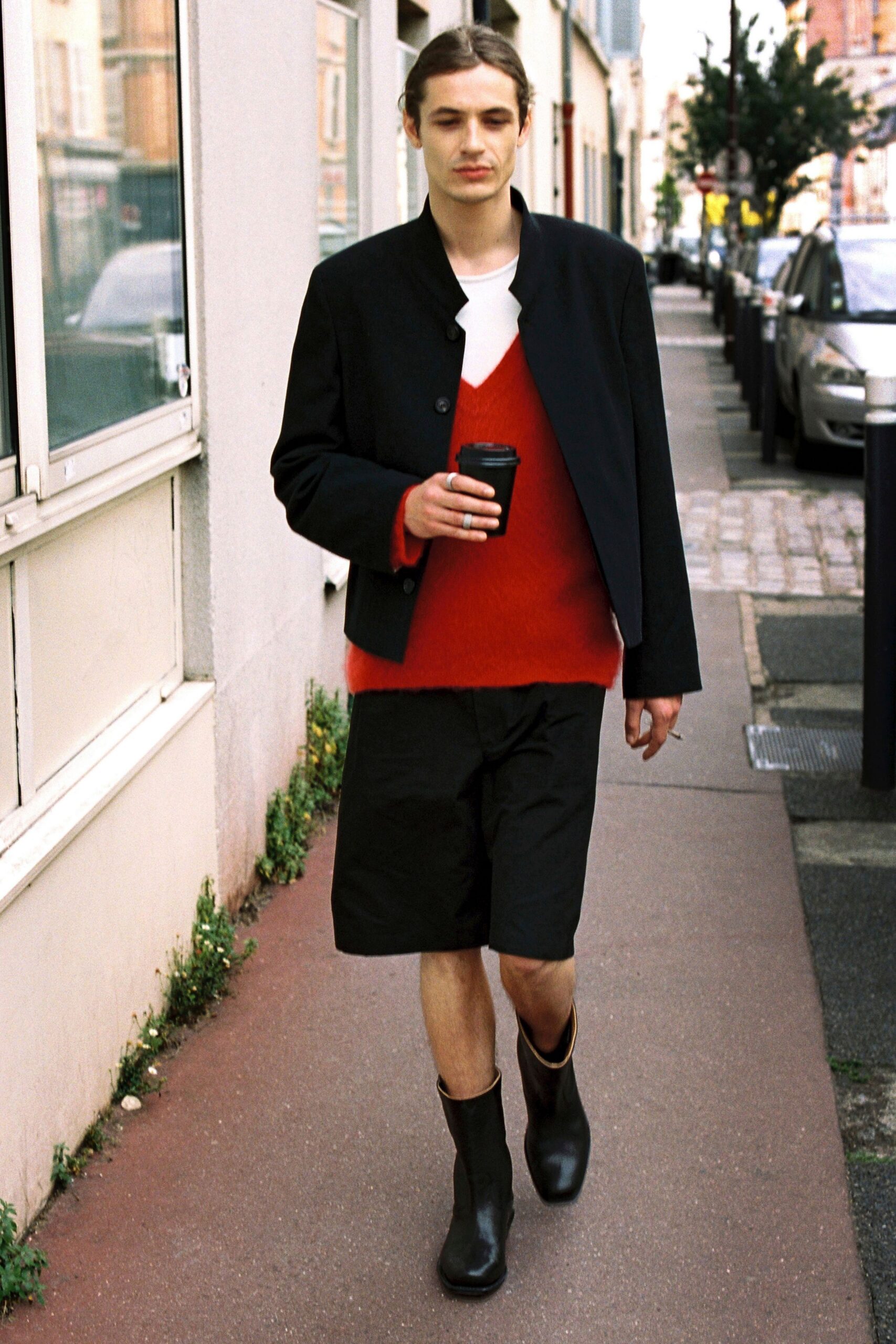 black jacket red sweater black shorts