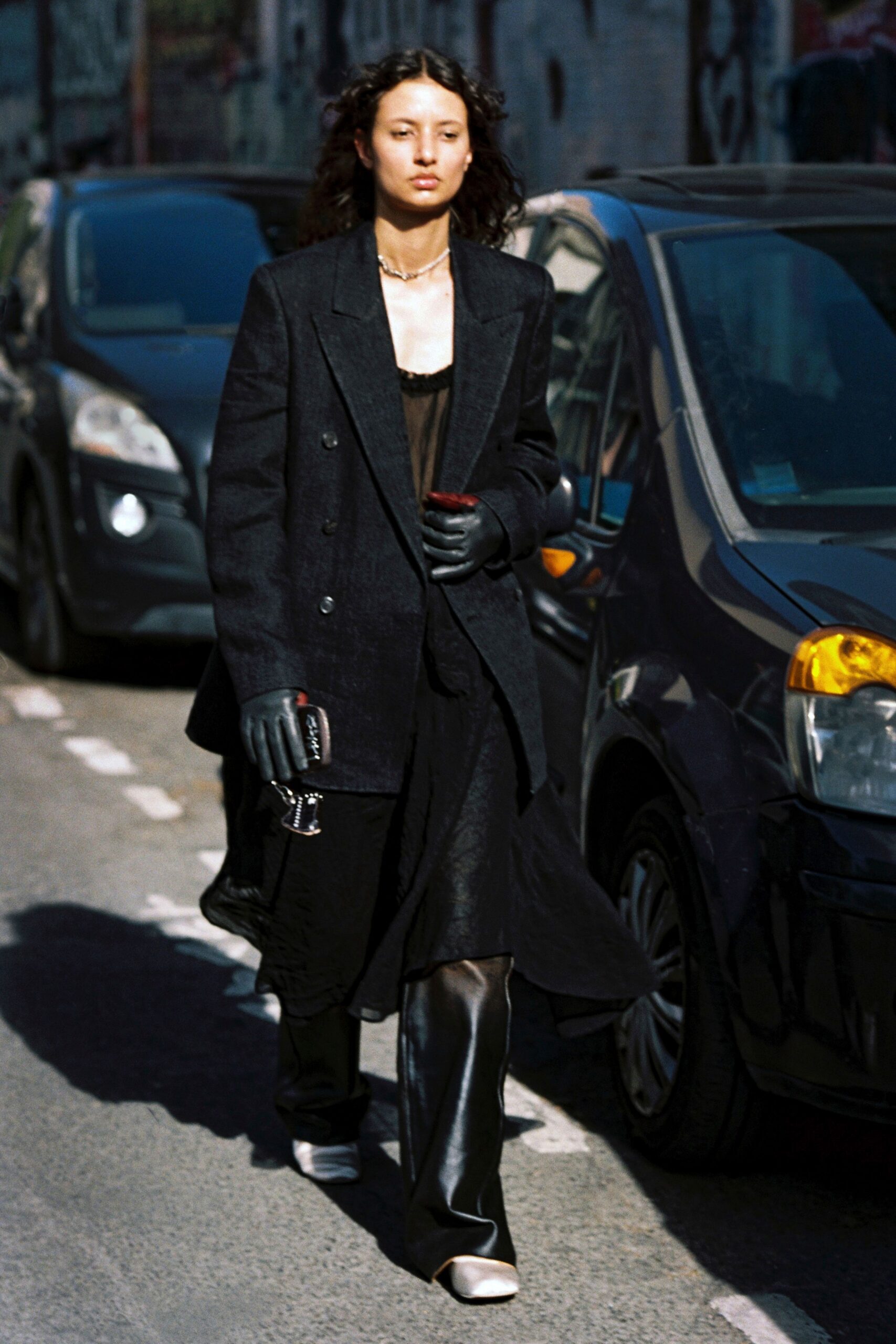 black wool long-sleeve collared structured buttoned coat