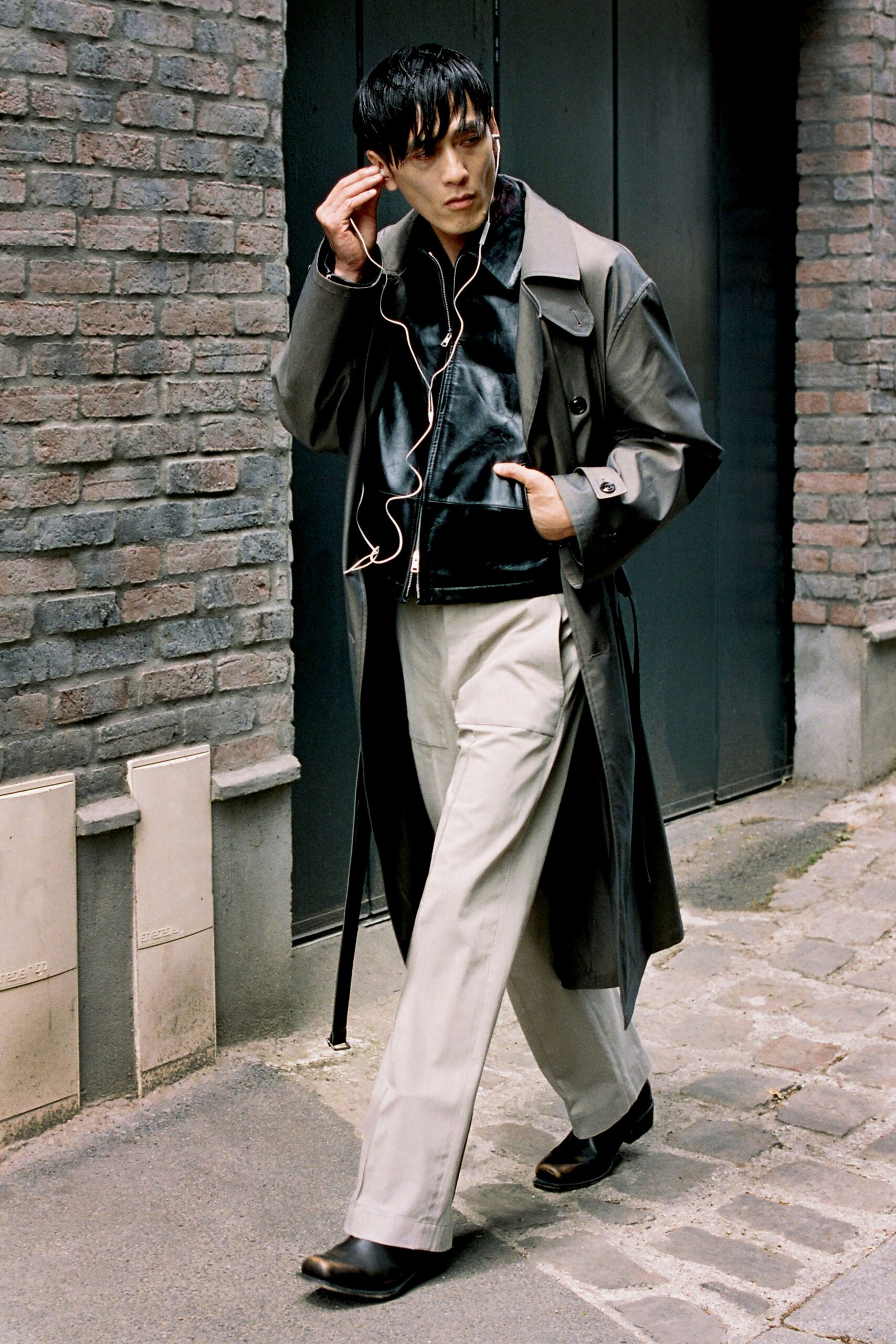 black leather long-sleeve collared structured buttoned trench