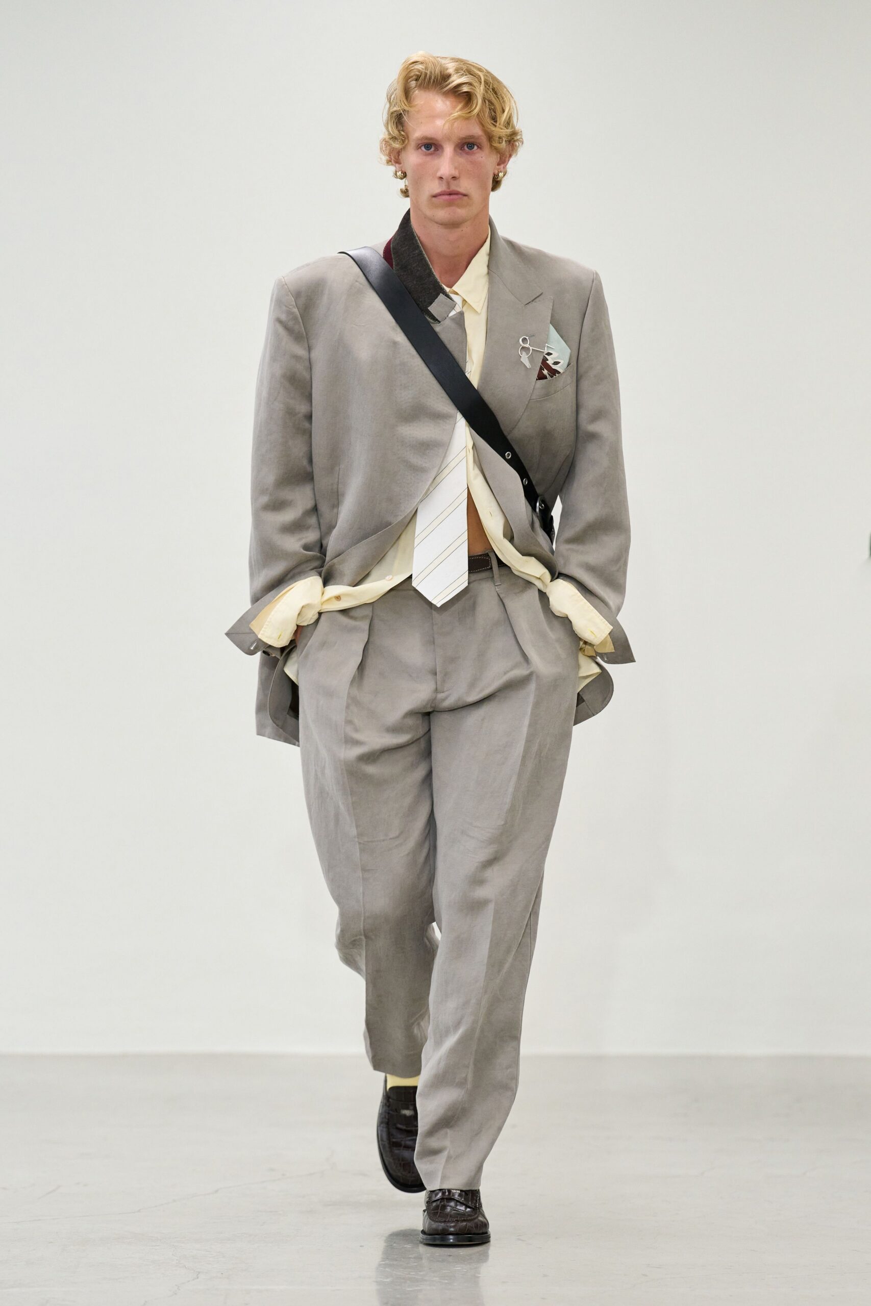 gray tailored suit with beige shirt