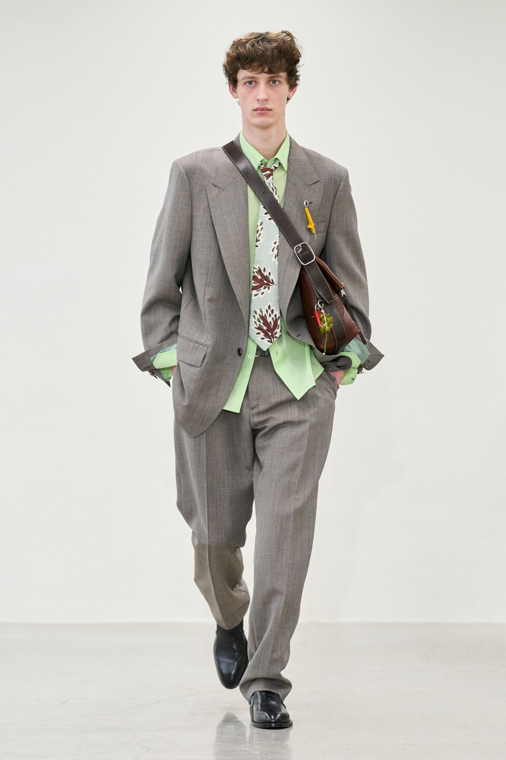 gray tailored suit with green shirt