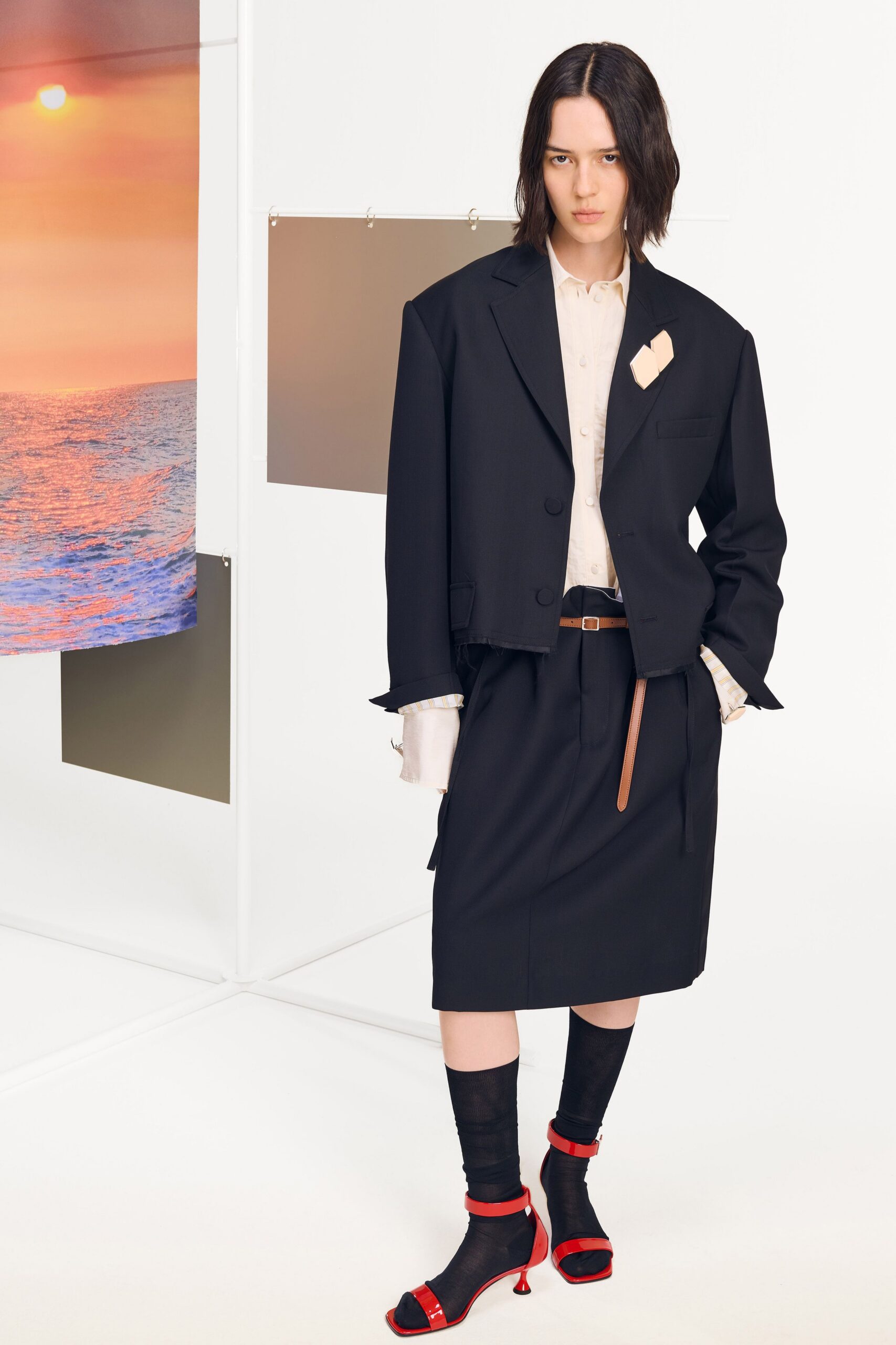 oversized black blazer with tailored skirt