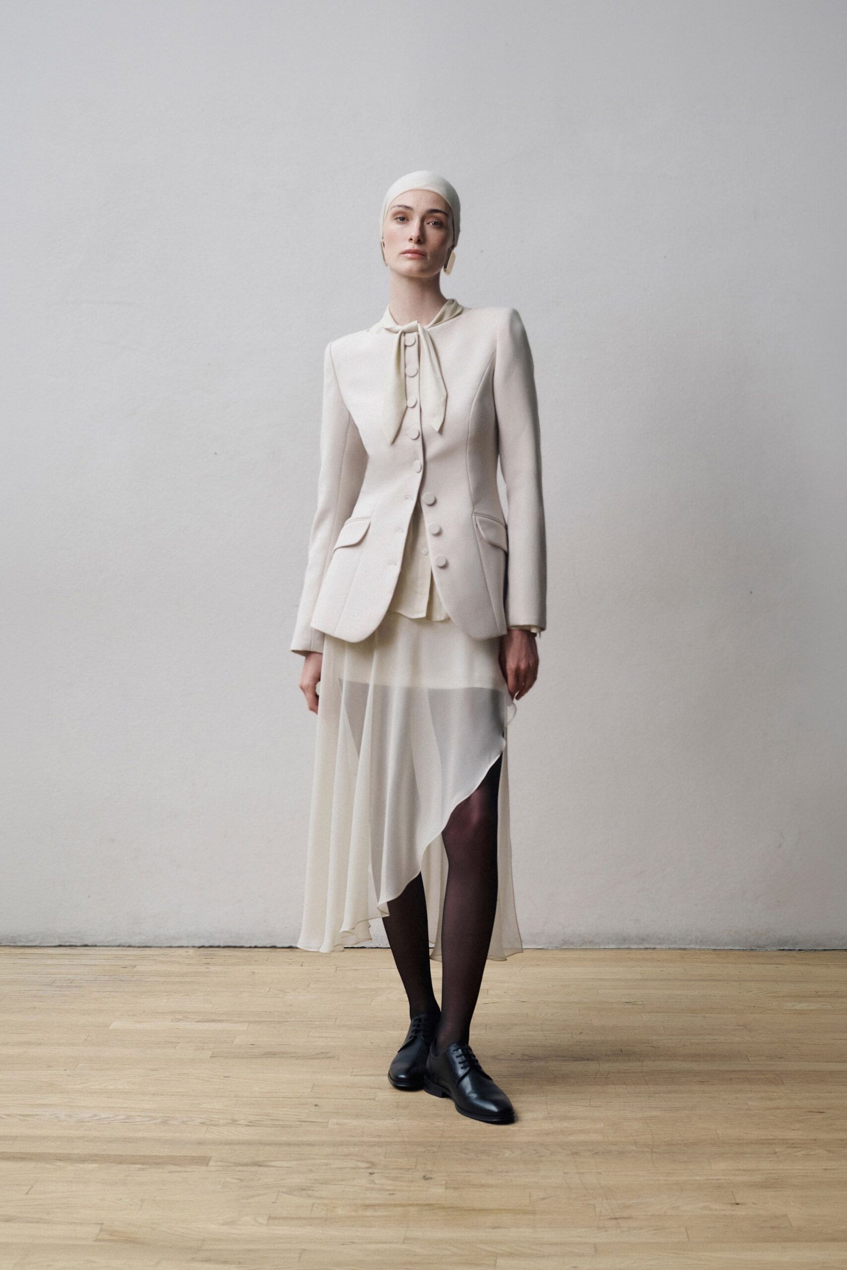white cotton long-sleeve collared structured buttoned blazer