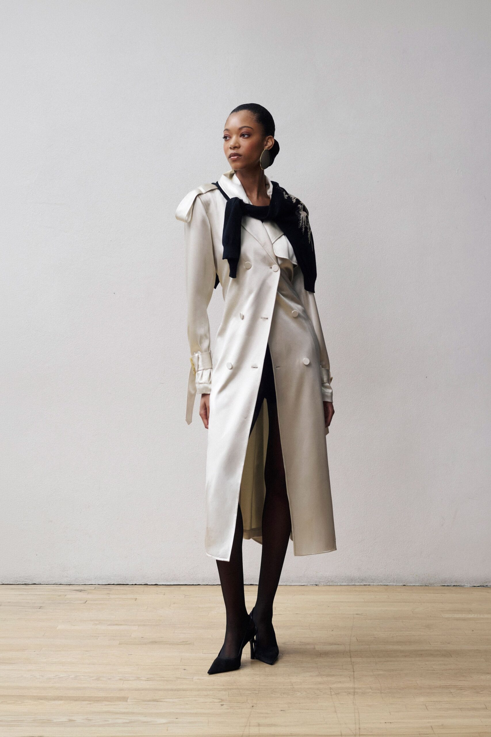 ivory satin long-sleeve collared fitted belted shiny trench