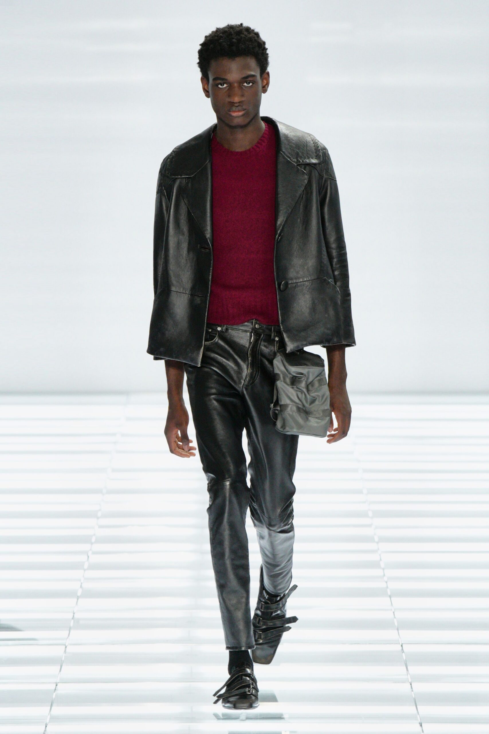 black leather jacket red sweater