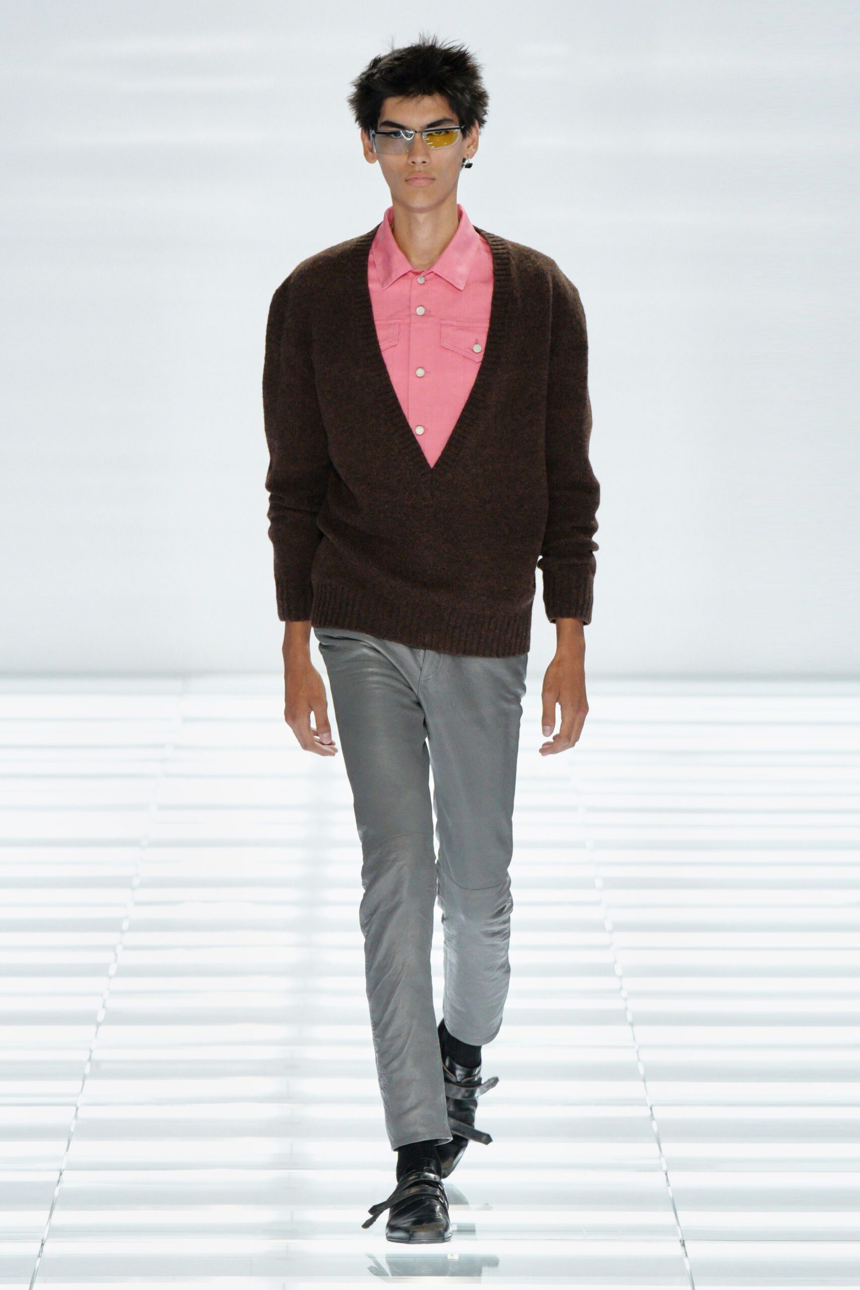 brown sweater pink shirt gray pants