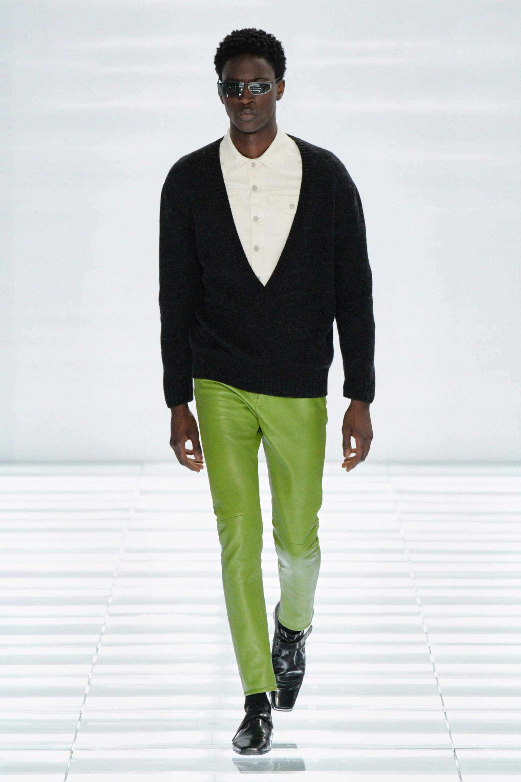 black sweater white shirt green pants