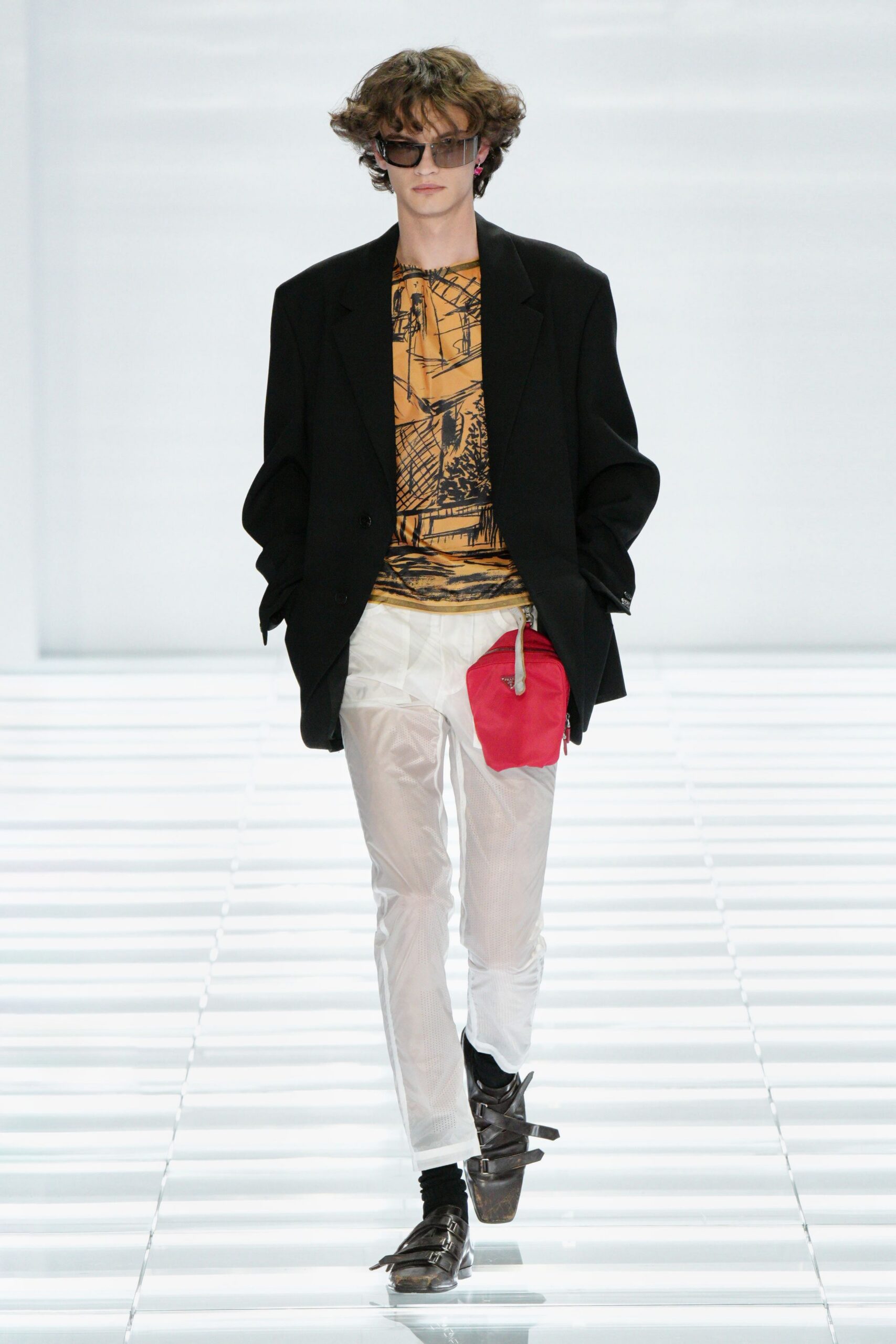 black blazer orange t-shirt white pants