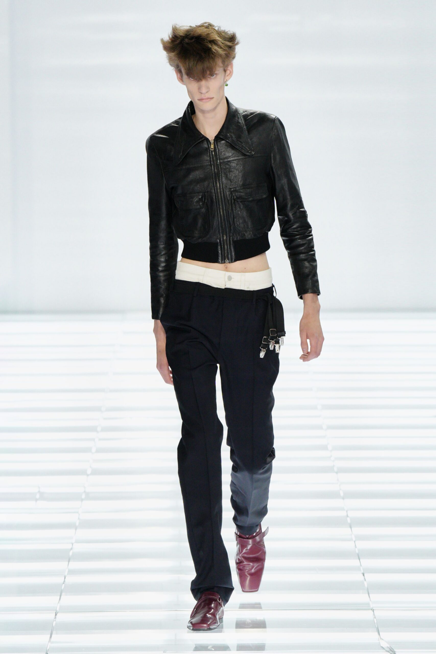 black leather fitted jacket with red shoes