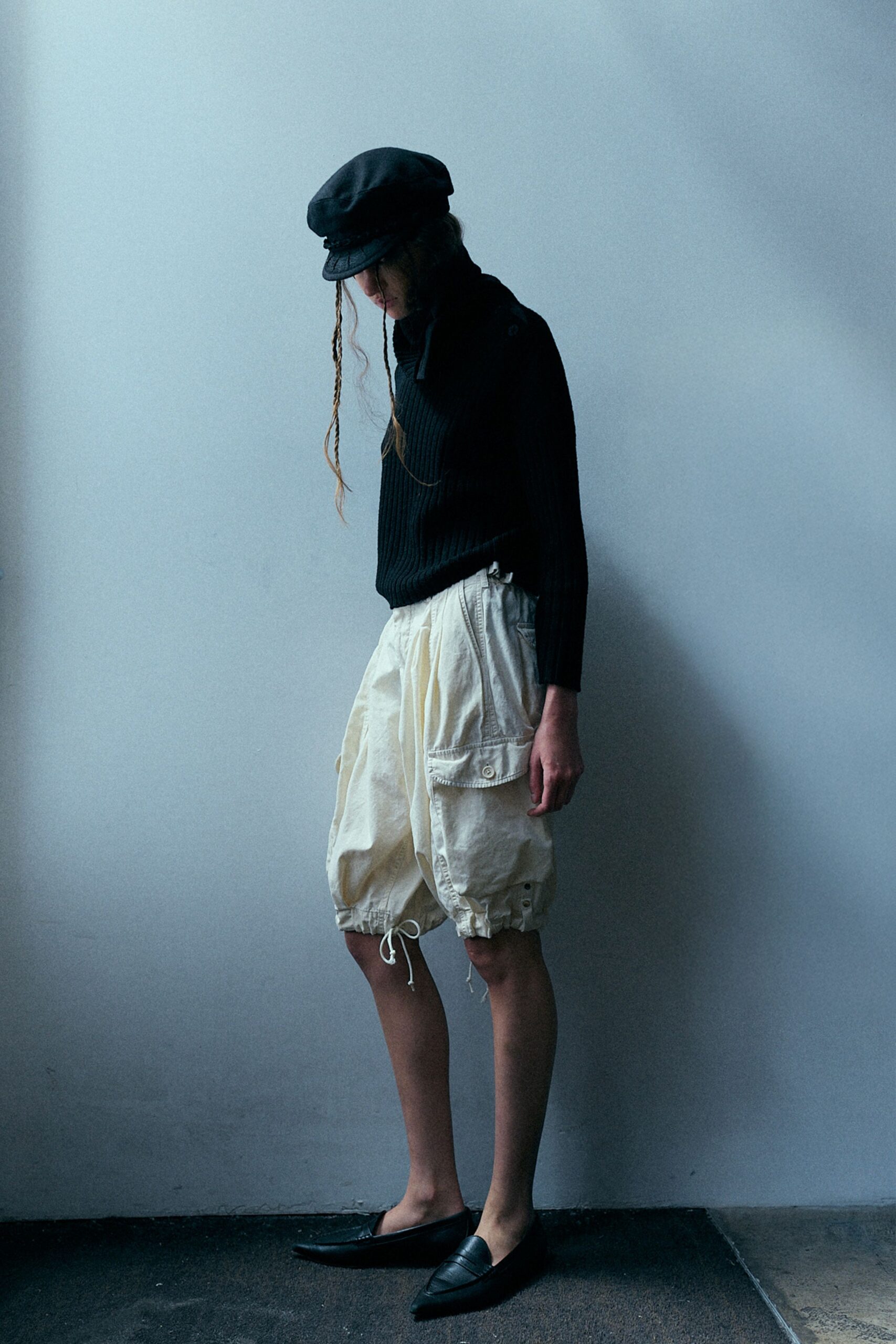 black sweater white cargo shorts