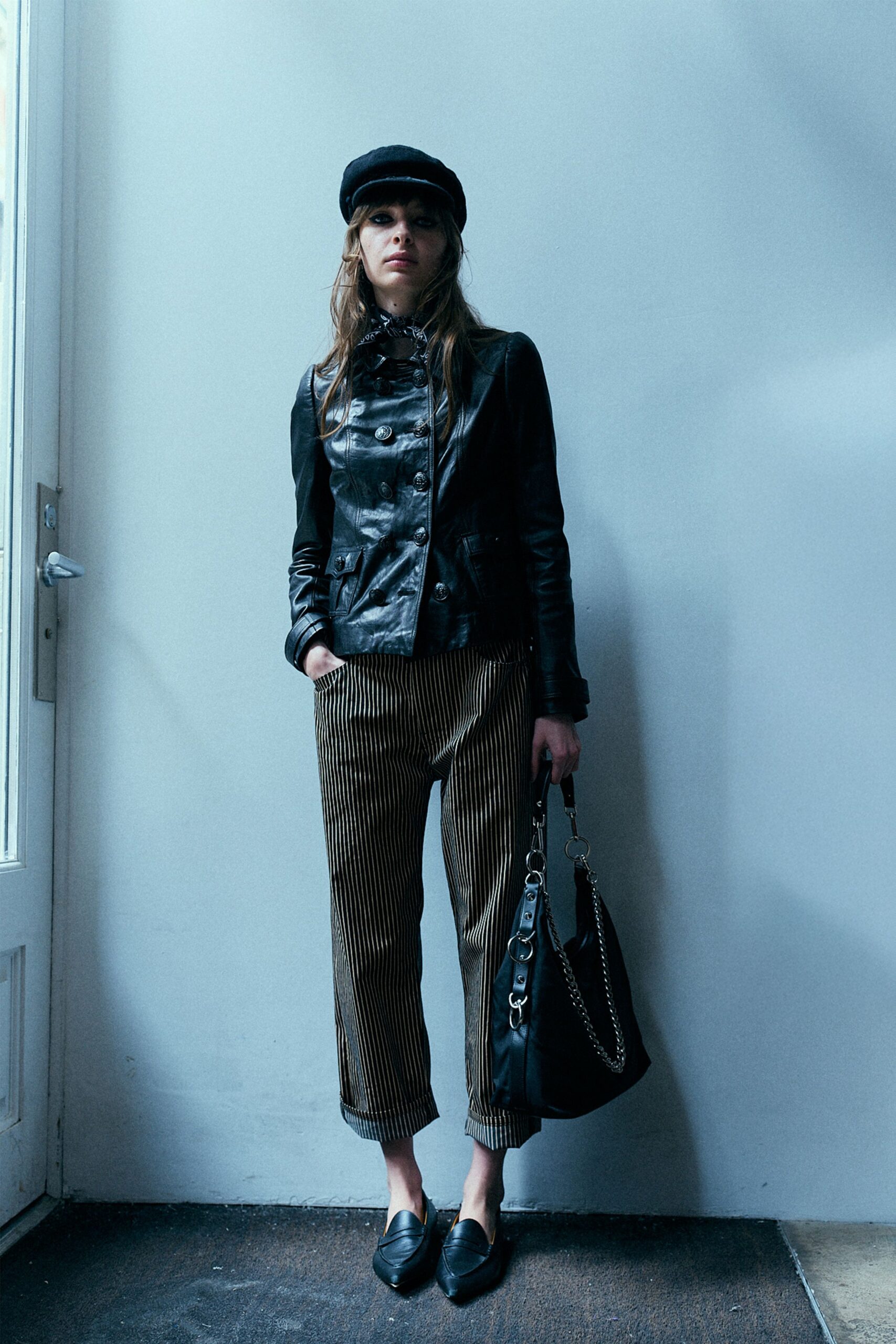 black leather jacket with striped pants