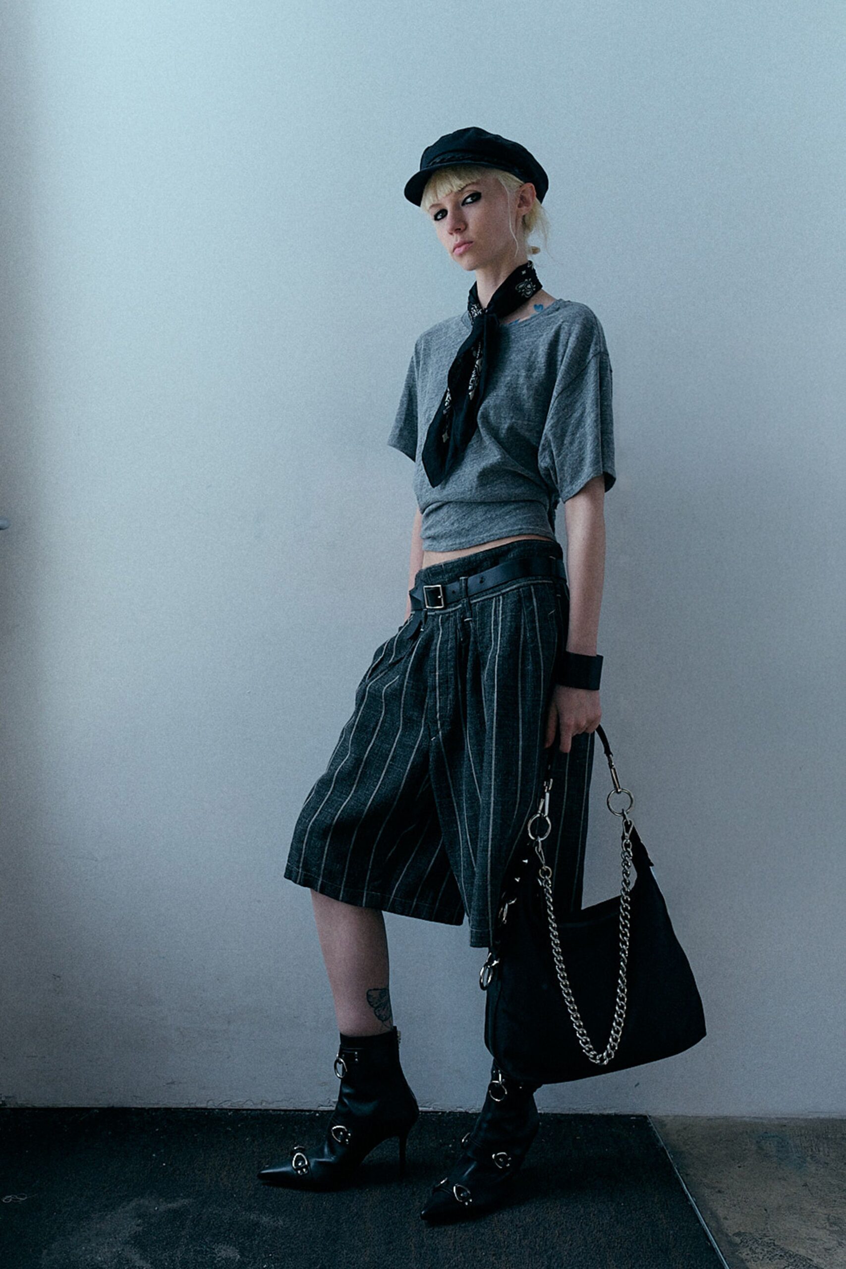 gray fitted top with black shorts