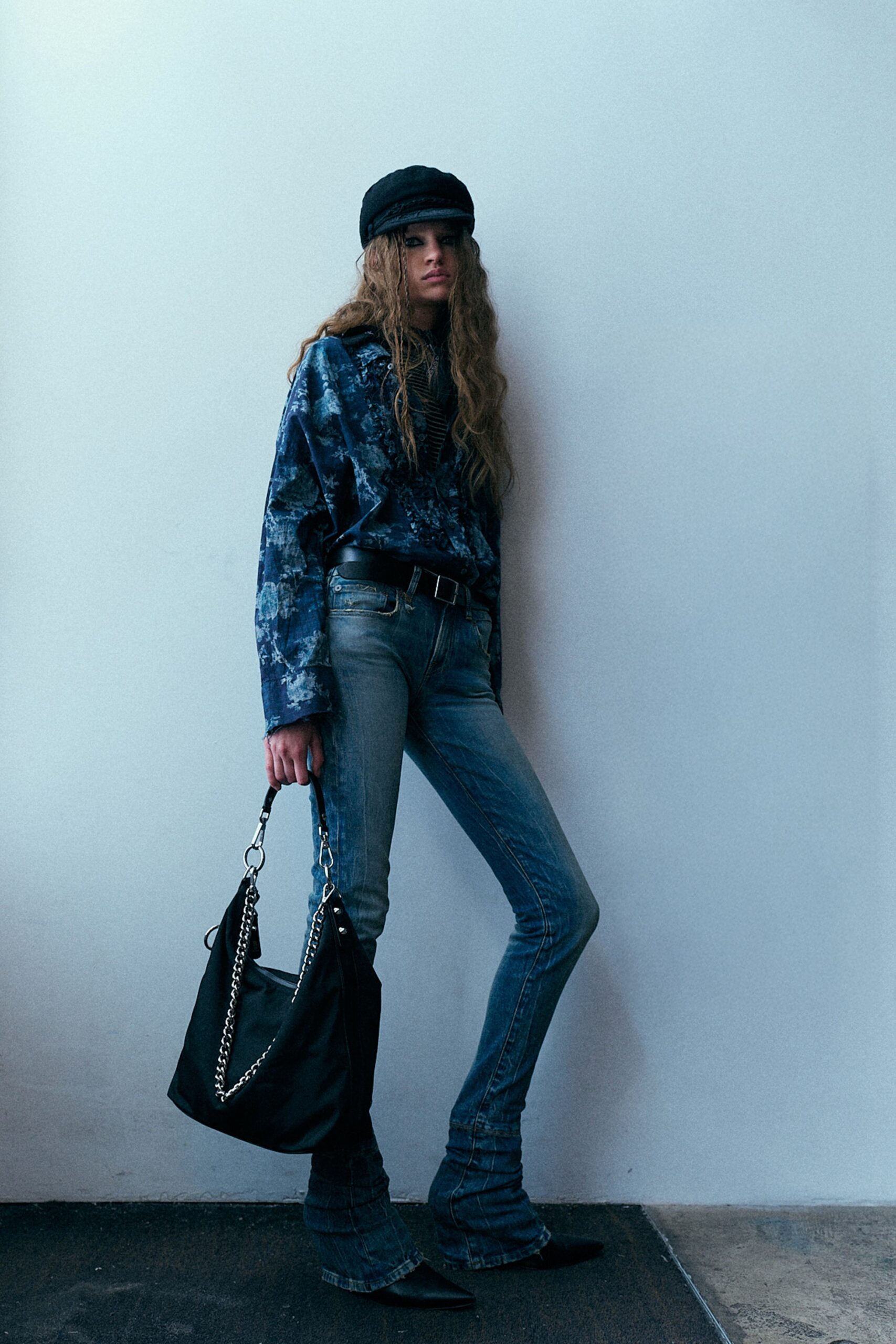 blue printed relaxed sweater with flared jeans