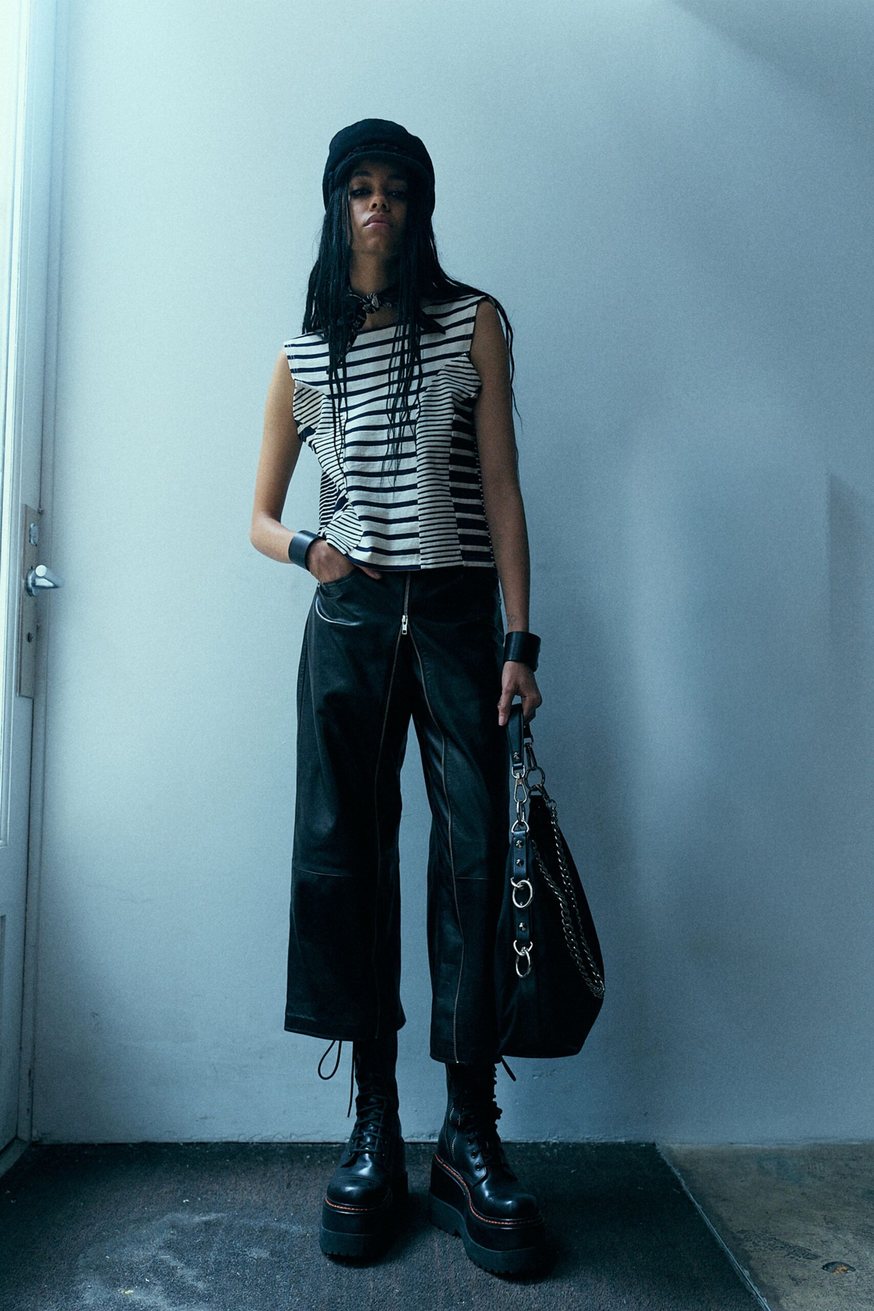 black and white striped top with leather pants