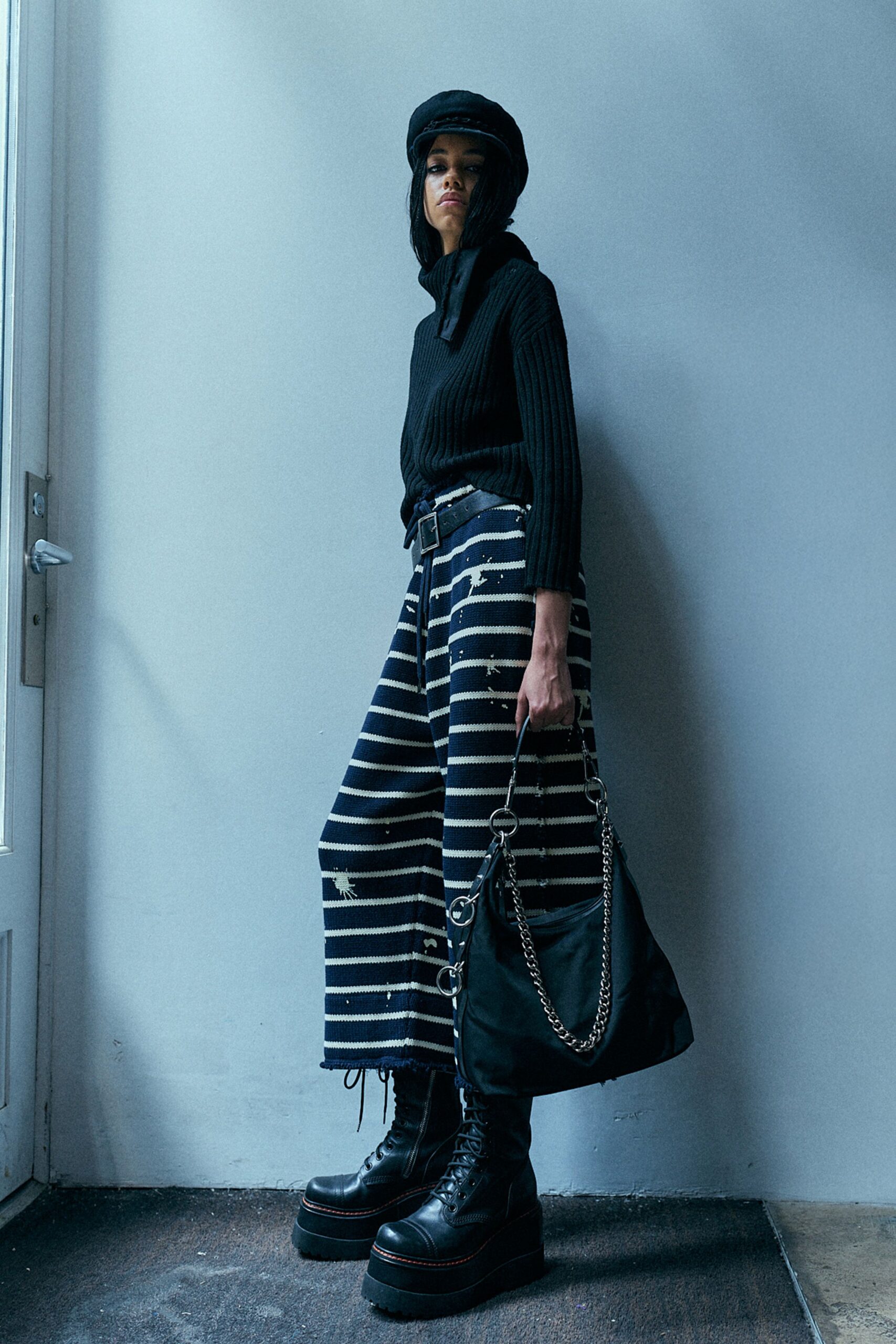 black ribbed top with striped pants