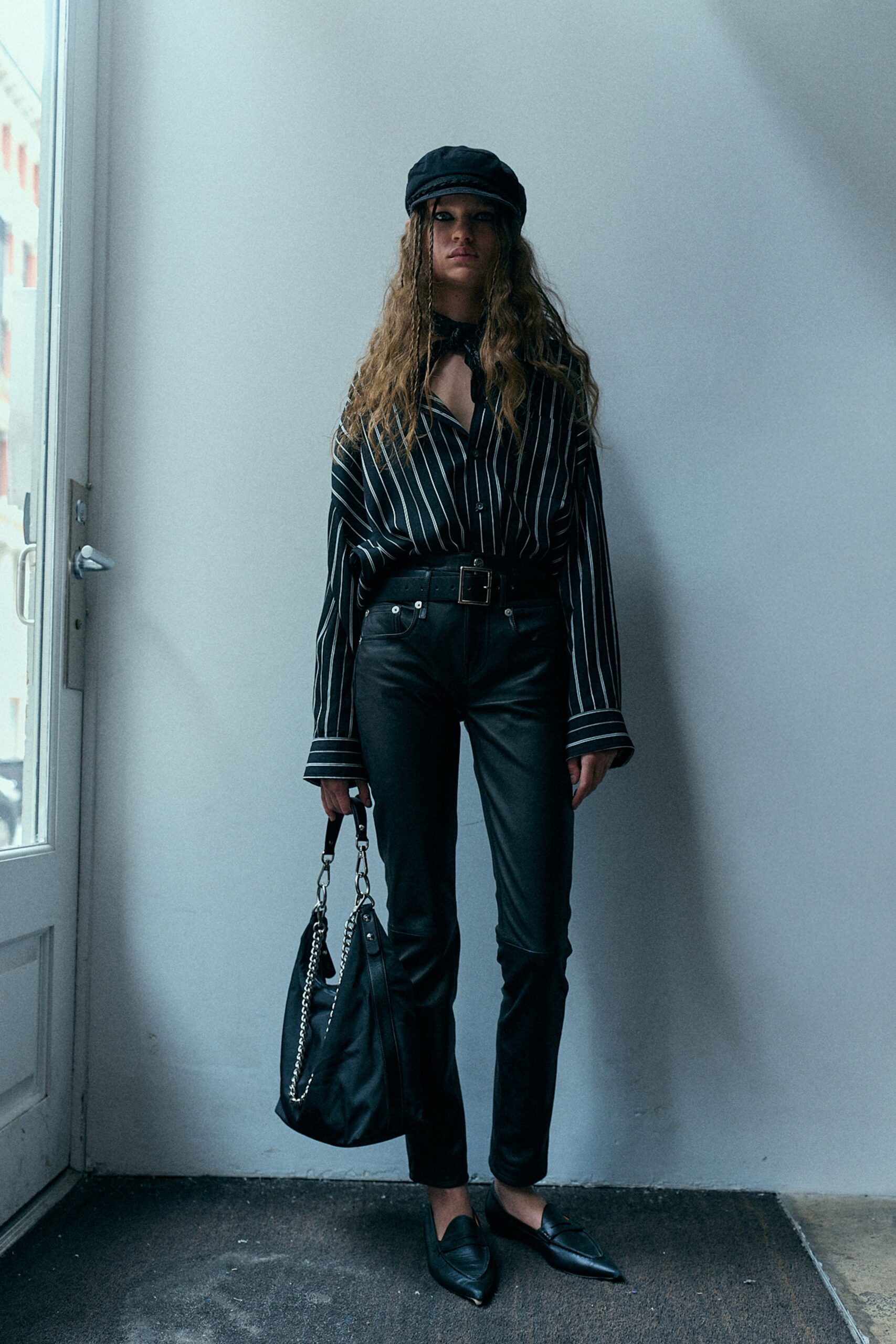 black striped shirt with leather pants
