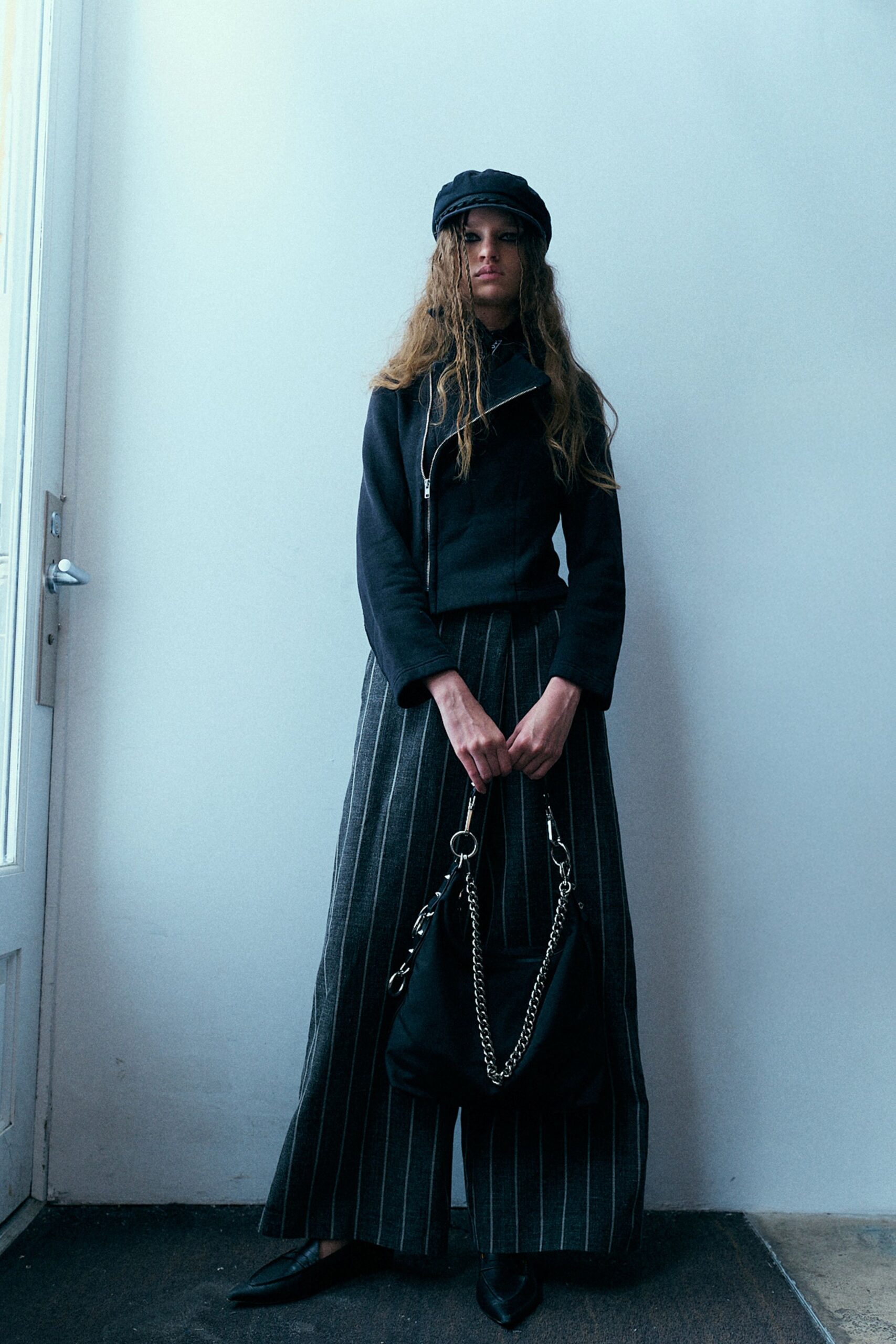 black jacket and striped skirt