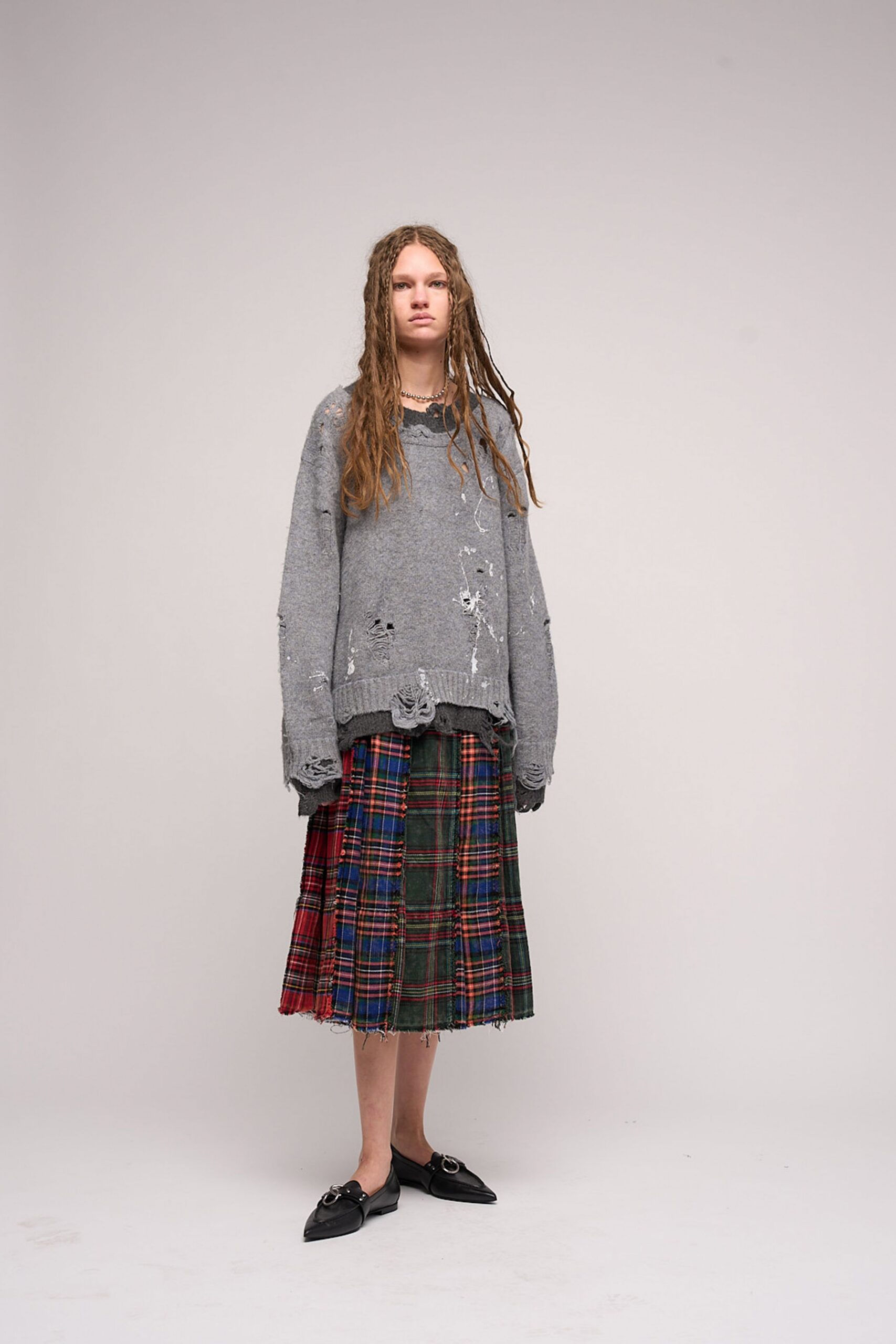 gray oversized sweater with plaid skirt