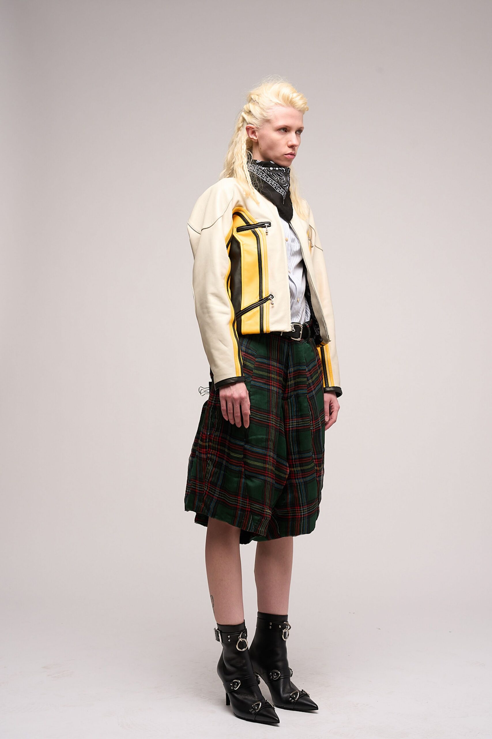 white leather jacket with plaid skirt