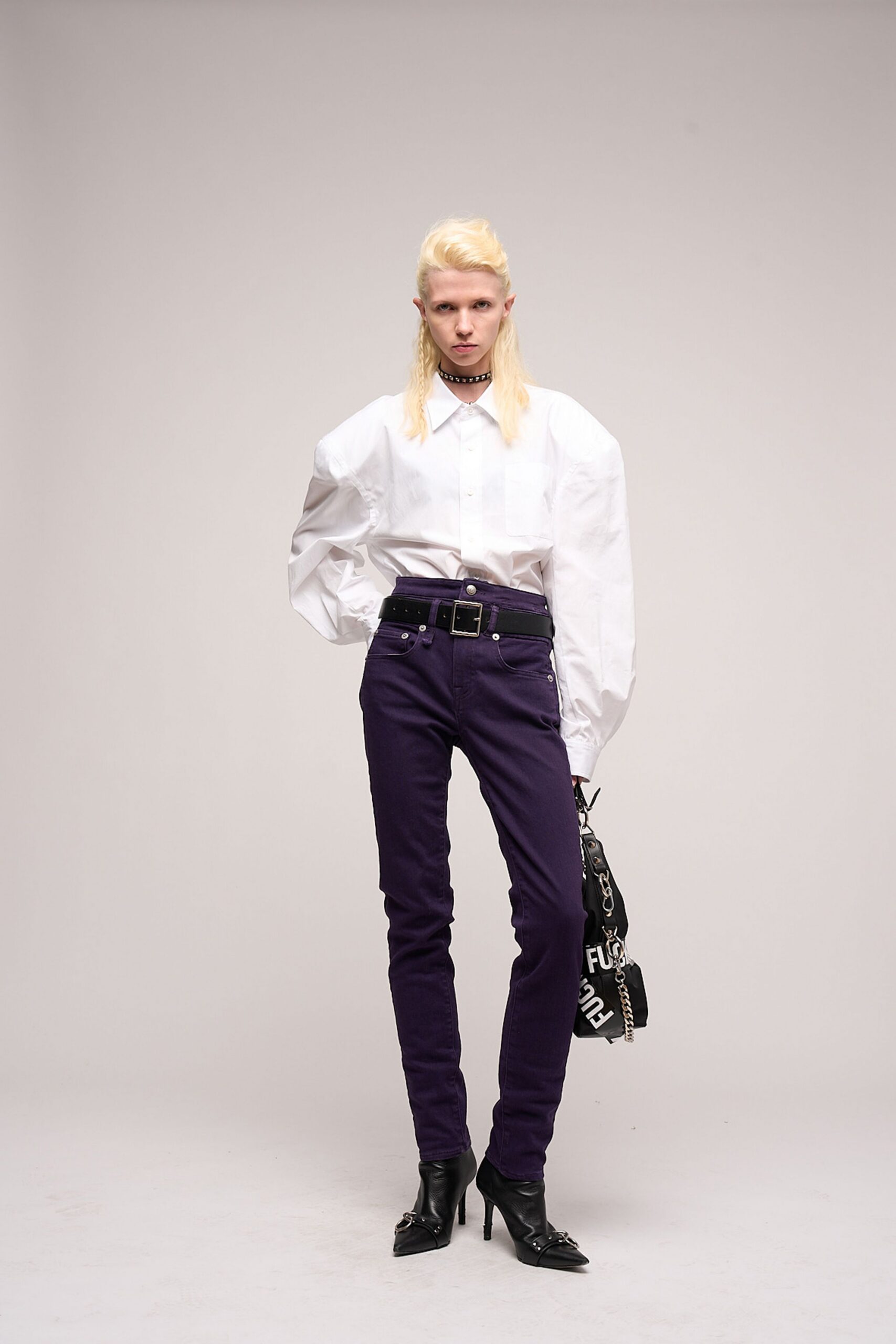 white relaxed shirt with purple pants