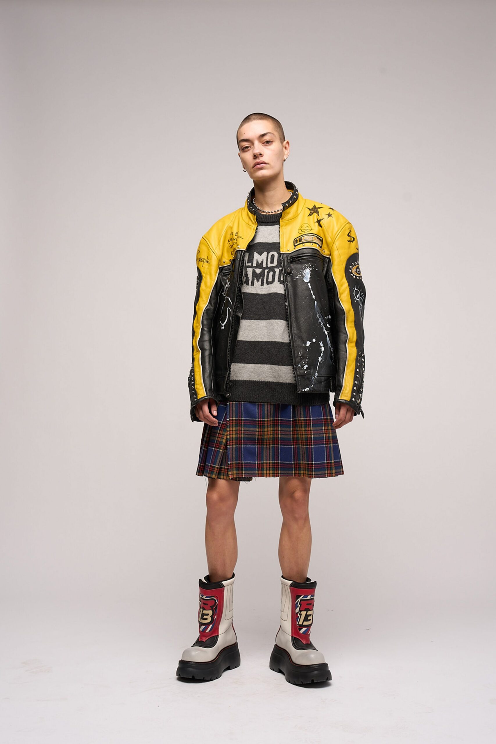 yellow leather jacket with plaid skirt