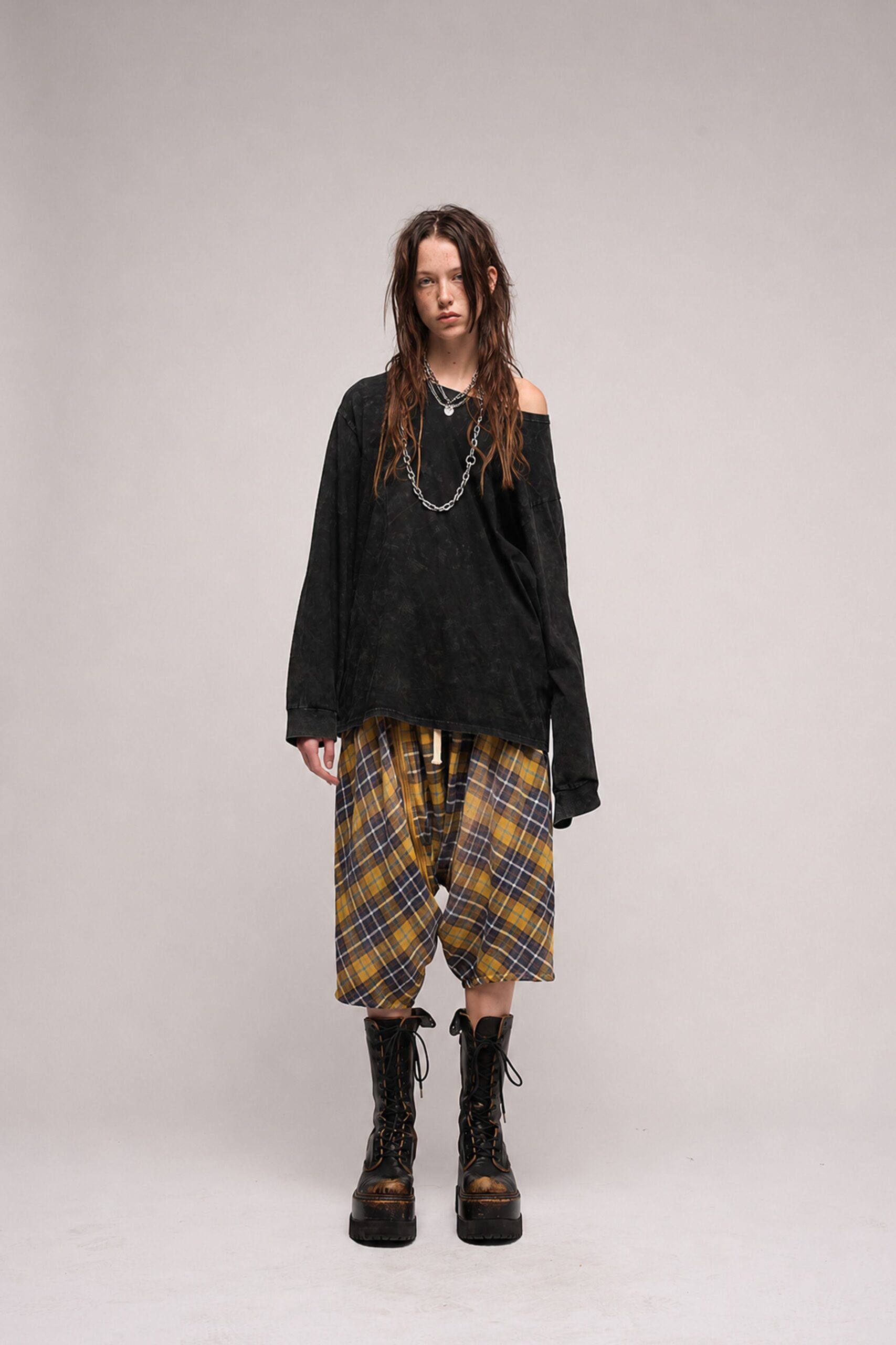 black relaxed top with checked pants