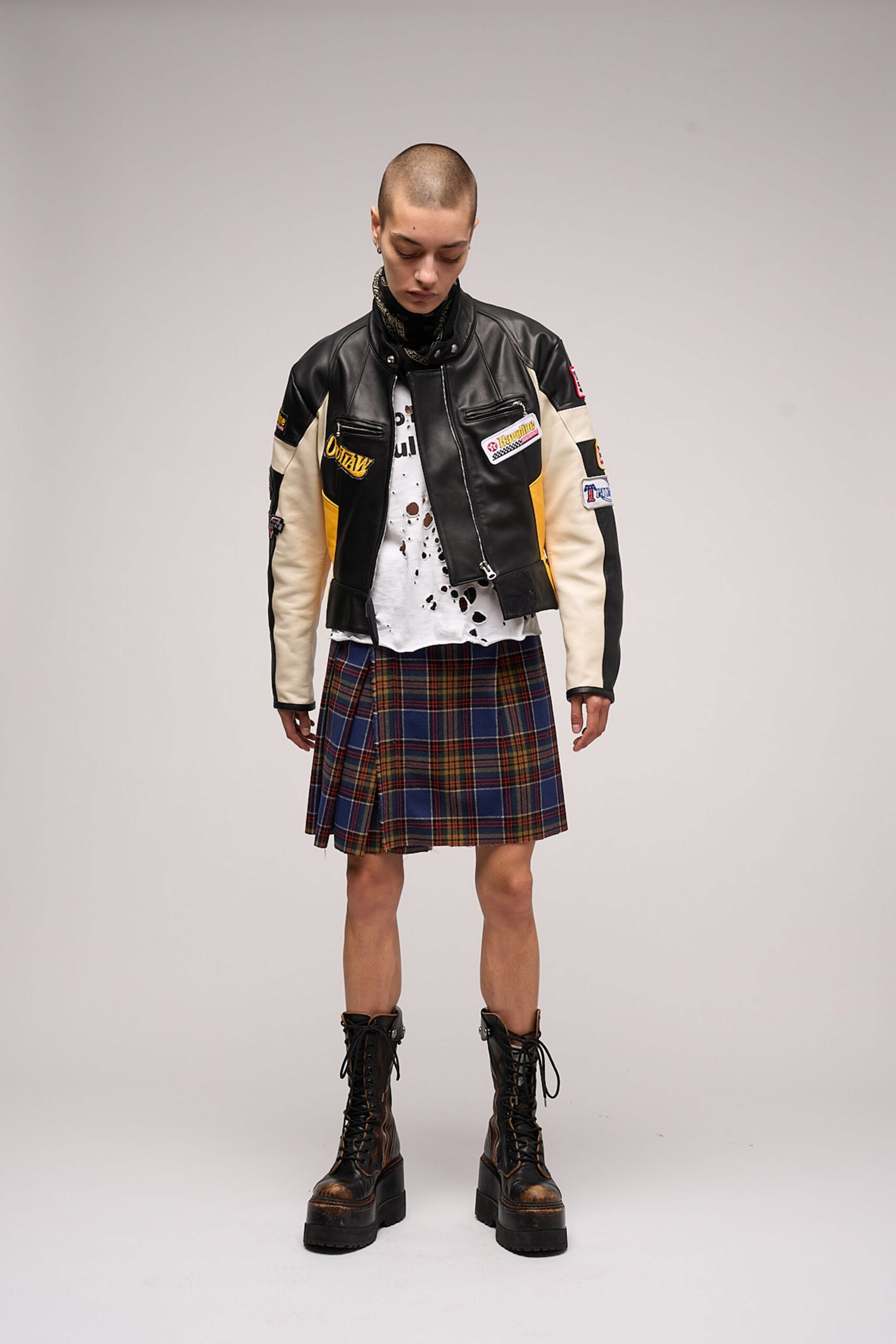 black leather jacket with plaid skirt