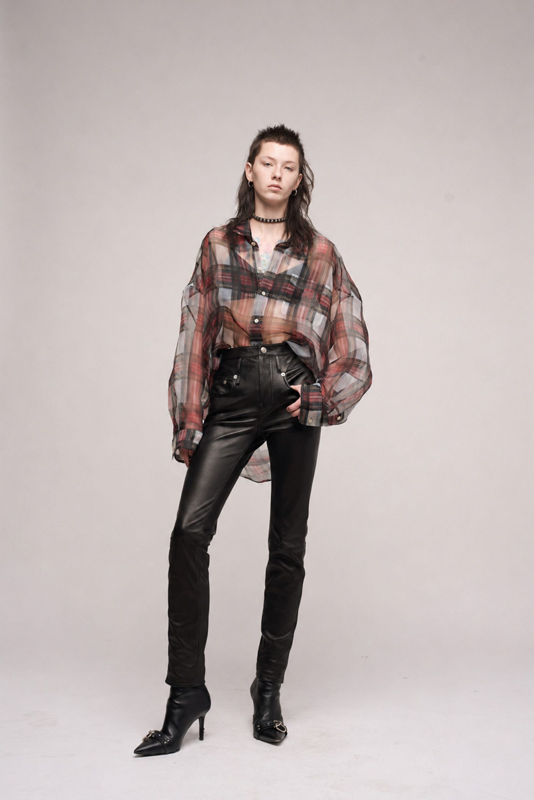 relaxed checked shirt with fitted leather pants