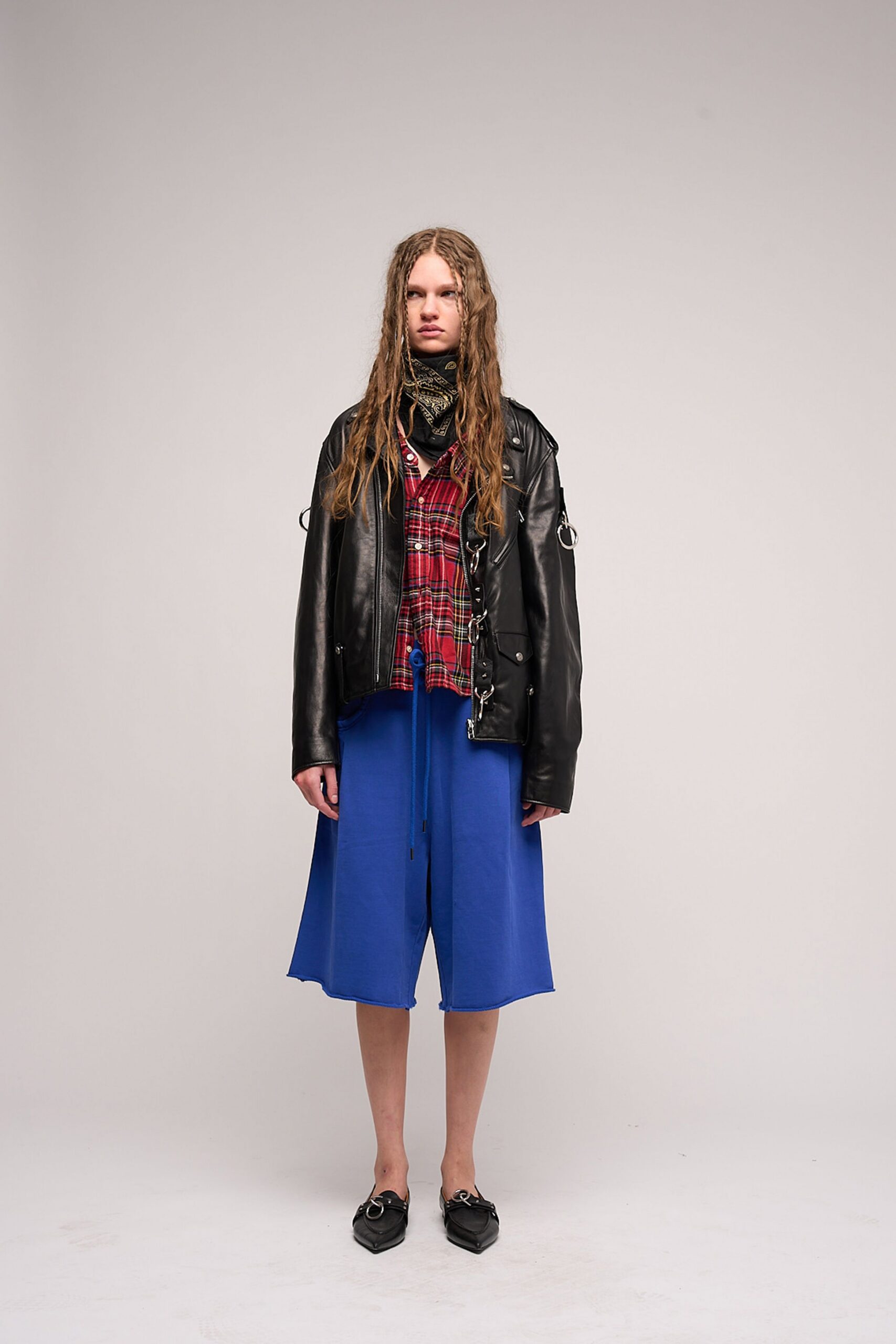 black leather jacket with blue skirt