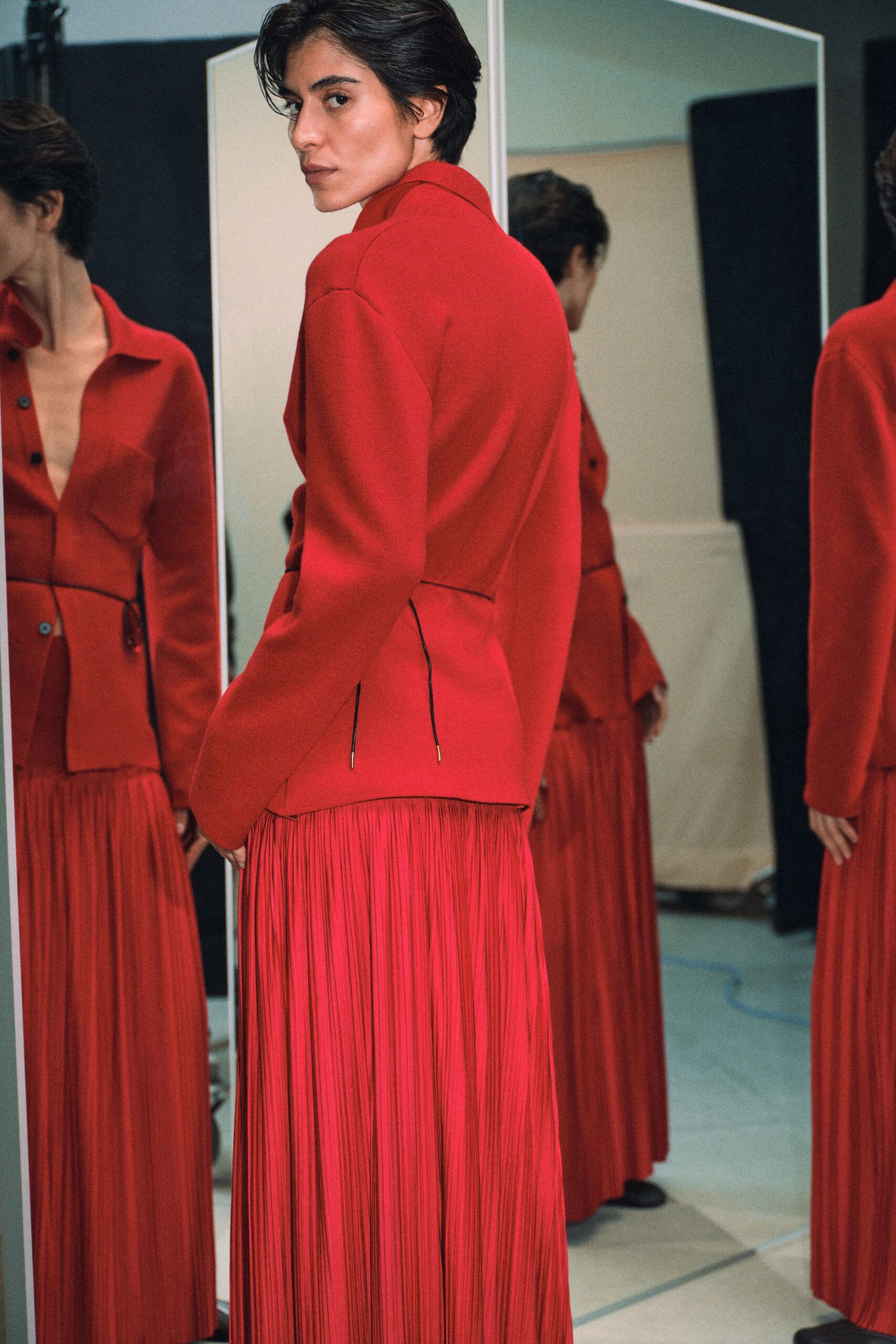 red silk sleeveless v-neck fitted pleated maxi dress