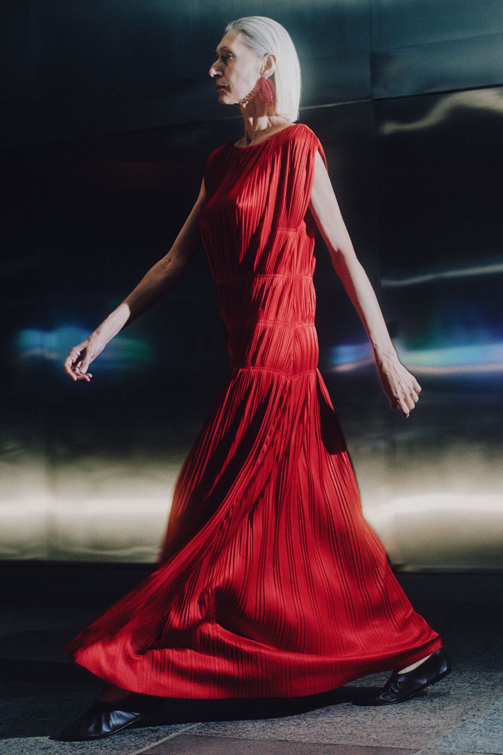 red silk sleeveless v-neck fitted pleated flowing dress
