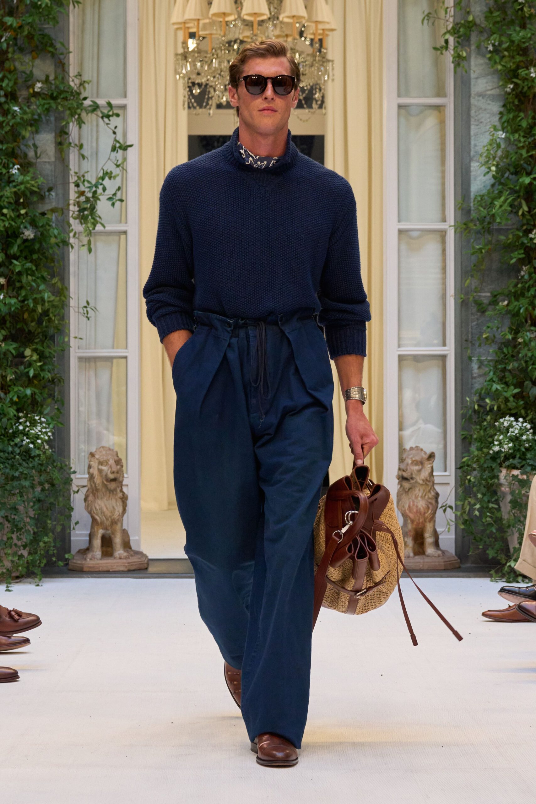 blue relaxed sweater with pleated pants