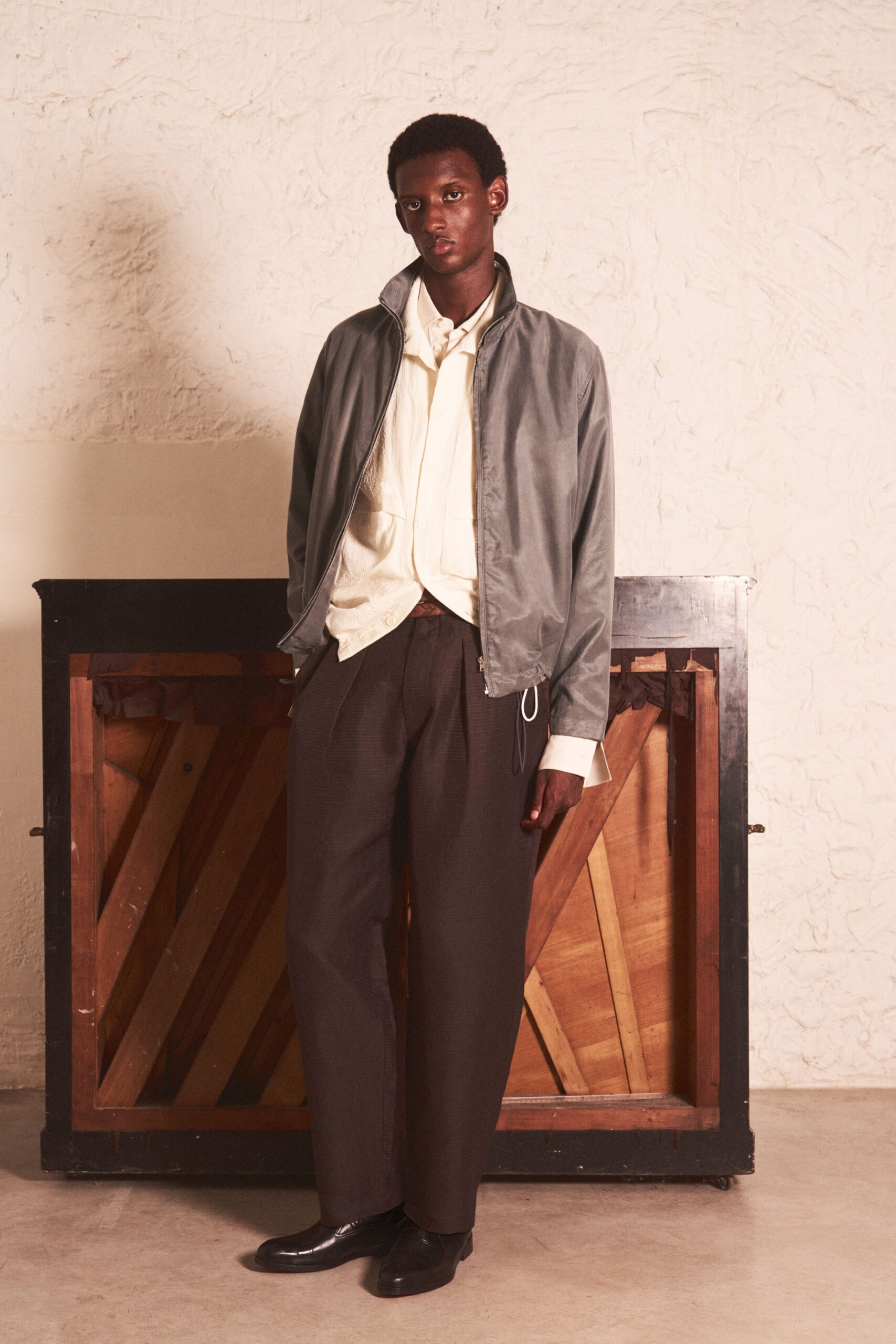 gray jacket white shirt brown pants