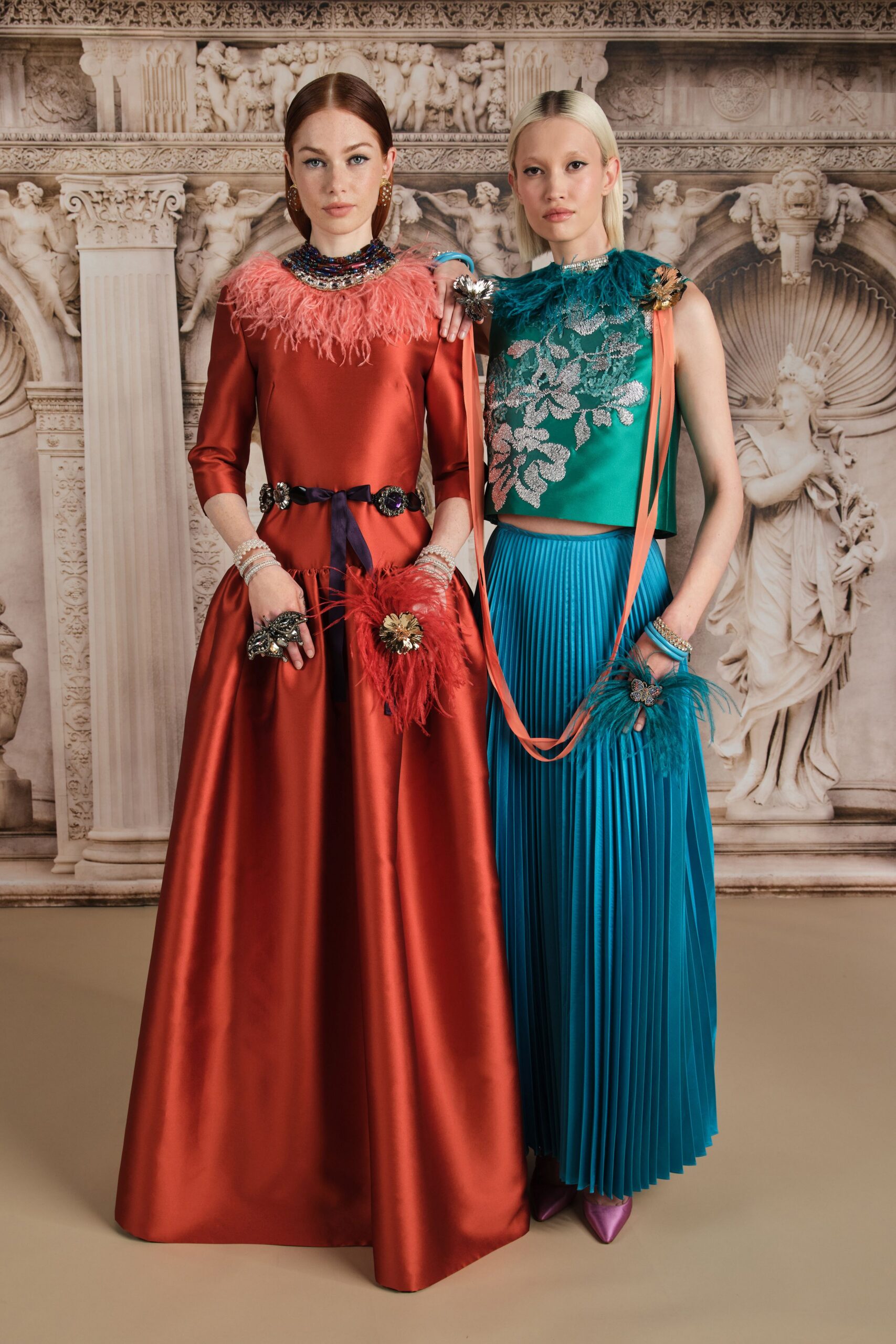 red satin long-sleeve high-neck fitted pleated embellished gown