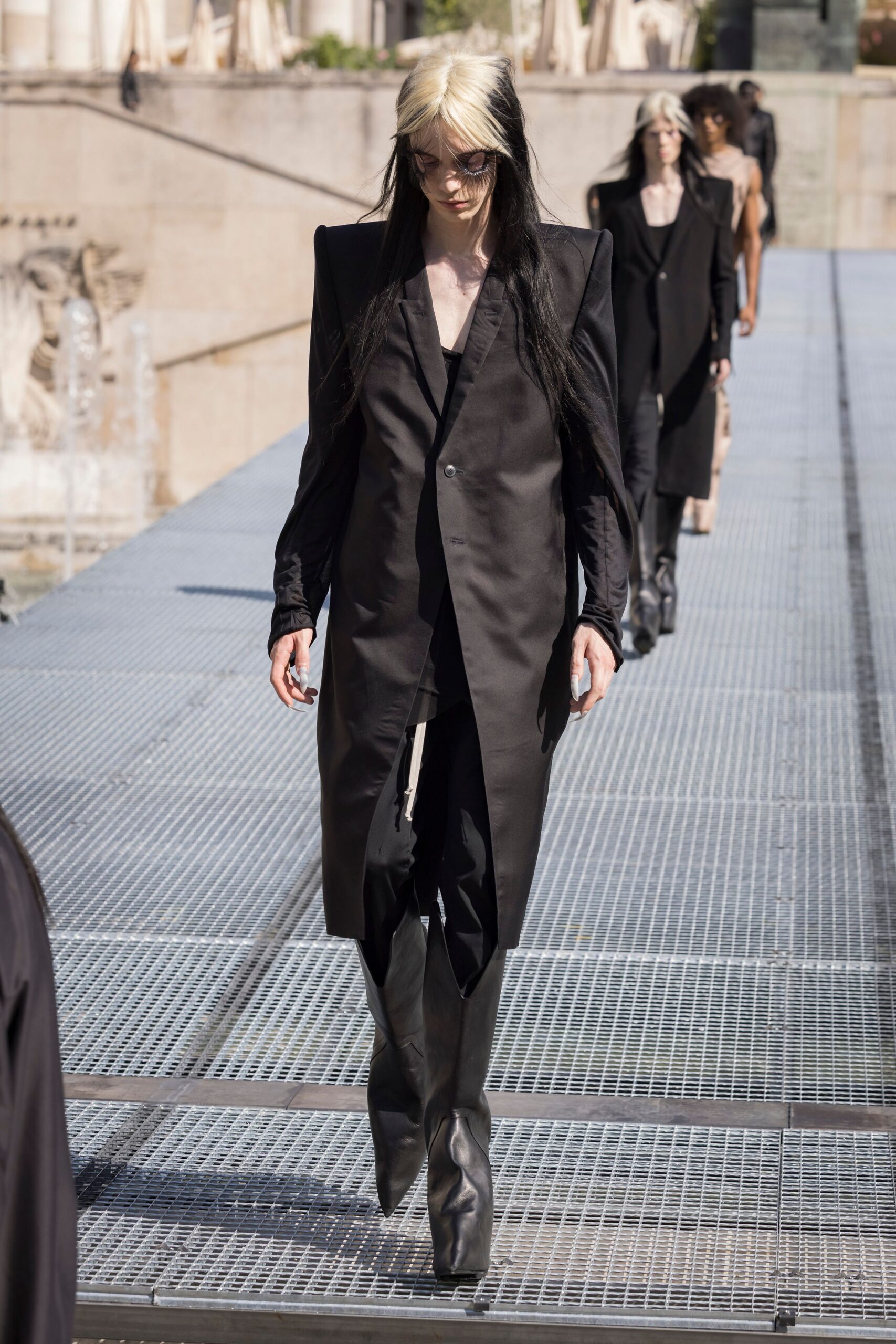 black fitted coat and boots