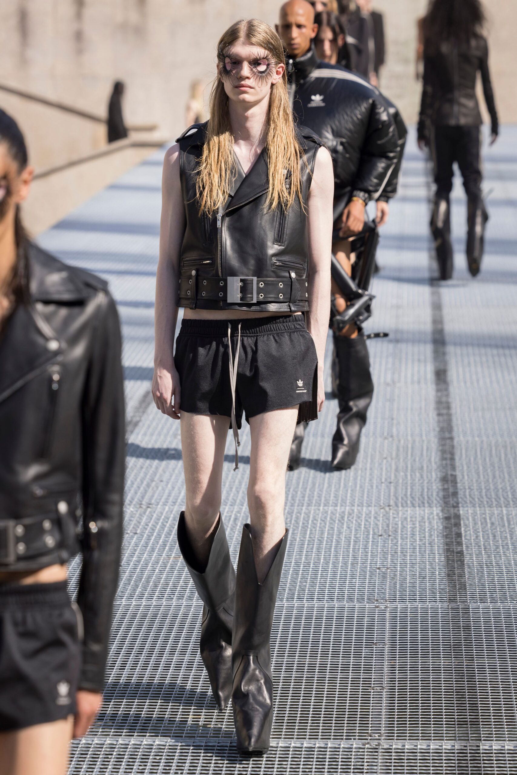 black leather fitted vest and shorts