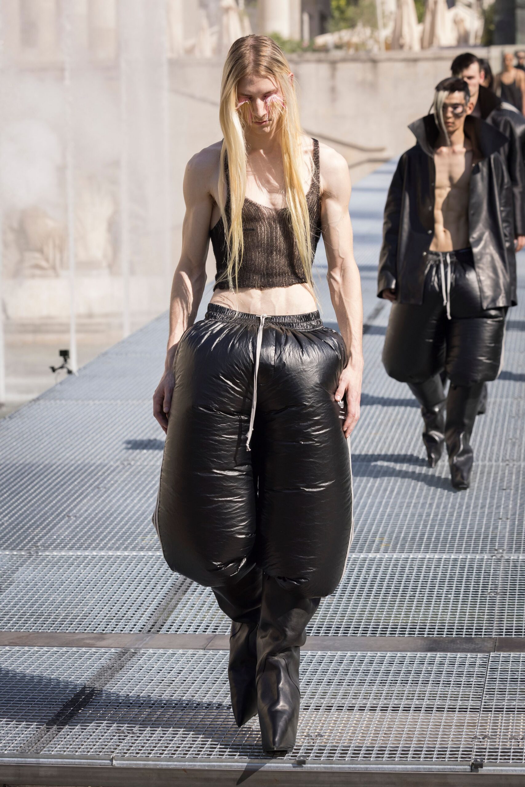 black mesh tank-top and vinyl pants