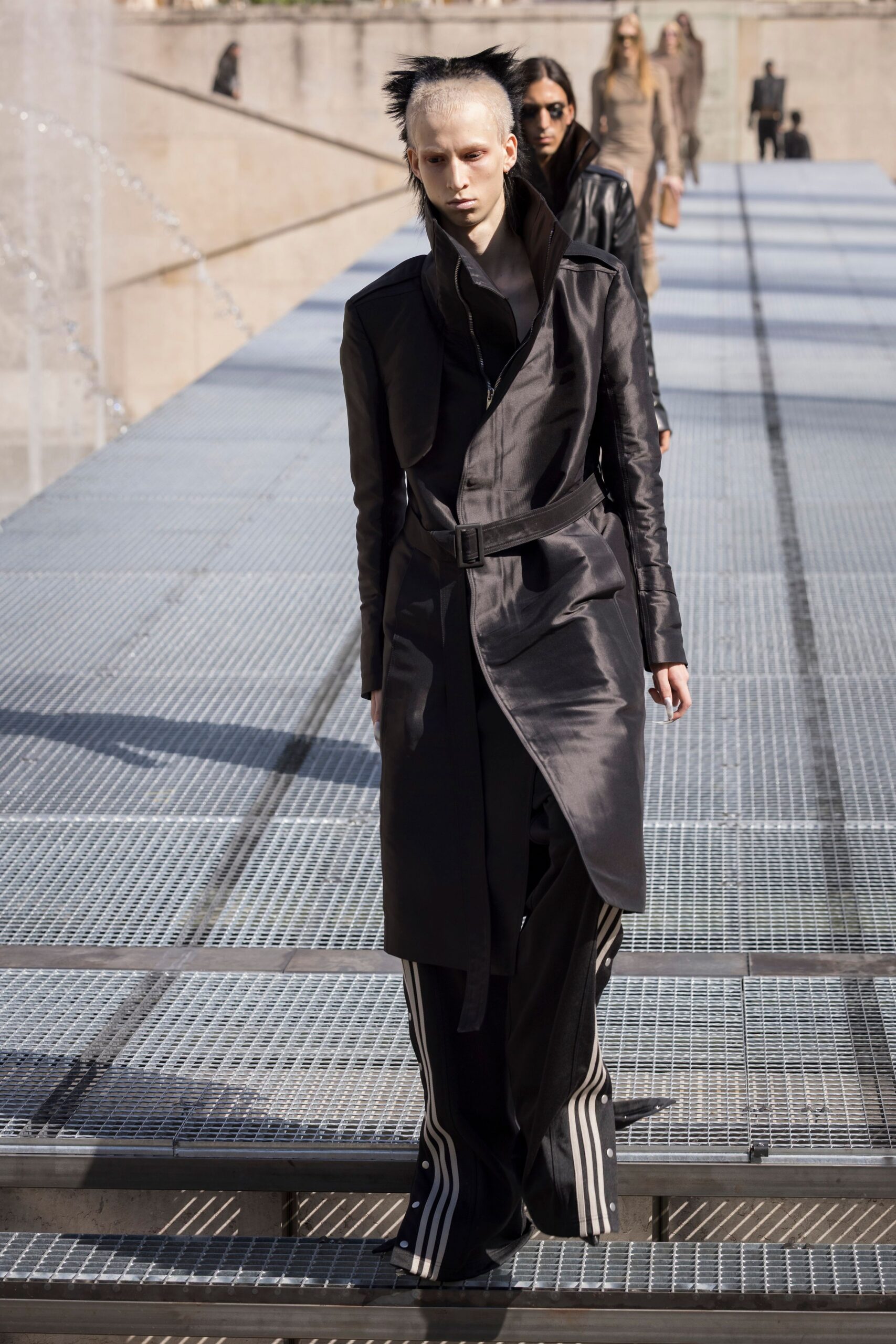 black silk belted coat and relaxed pants