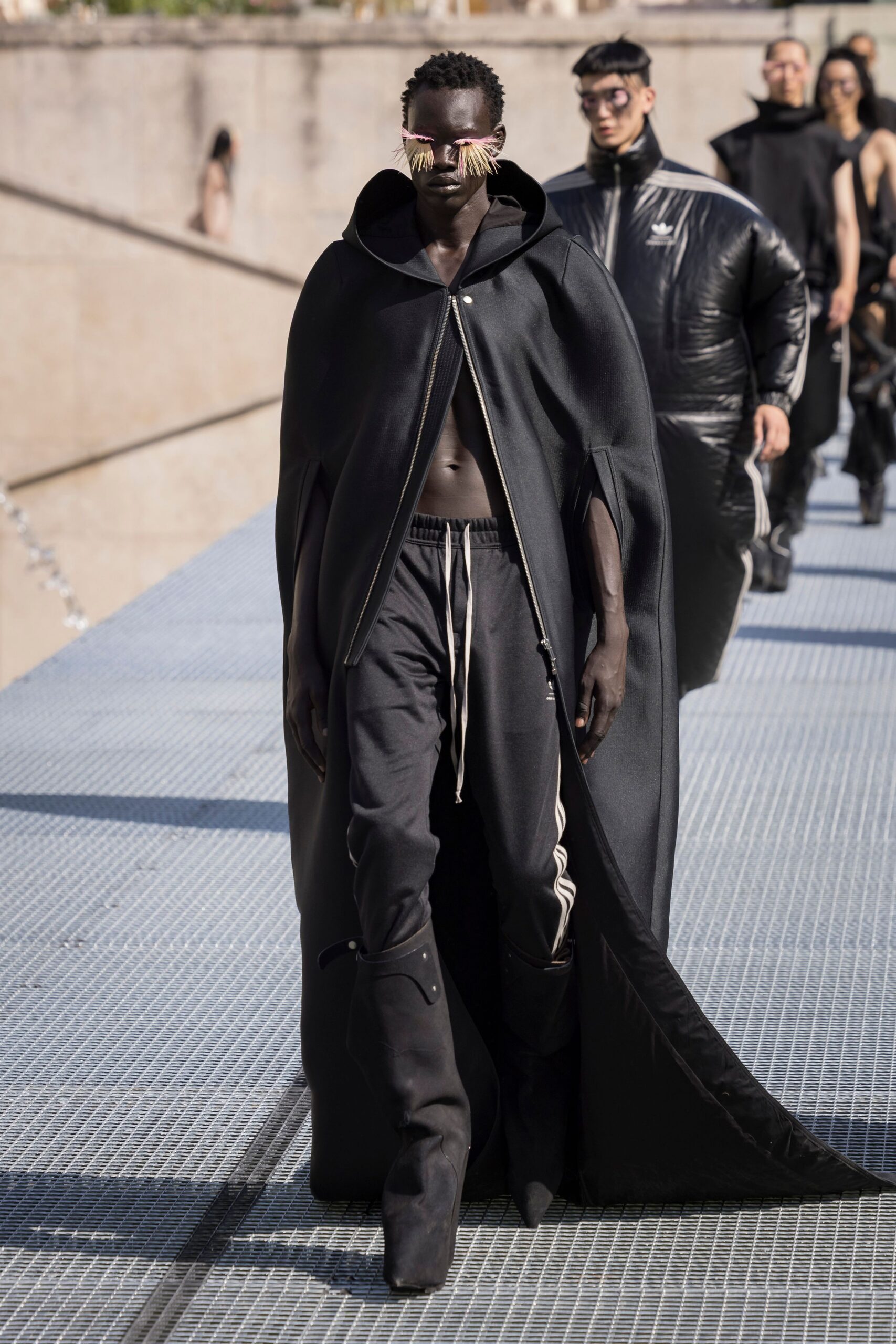 black wool cape with fitted pants