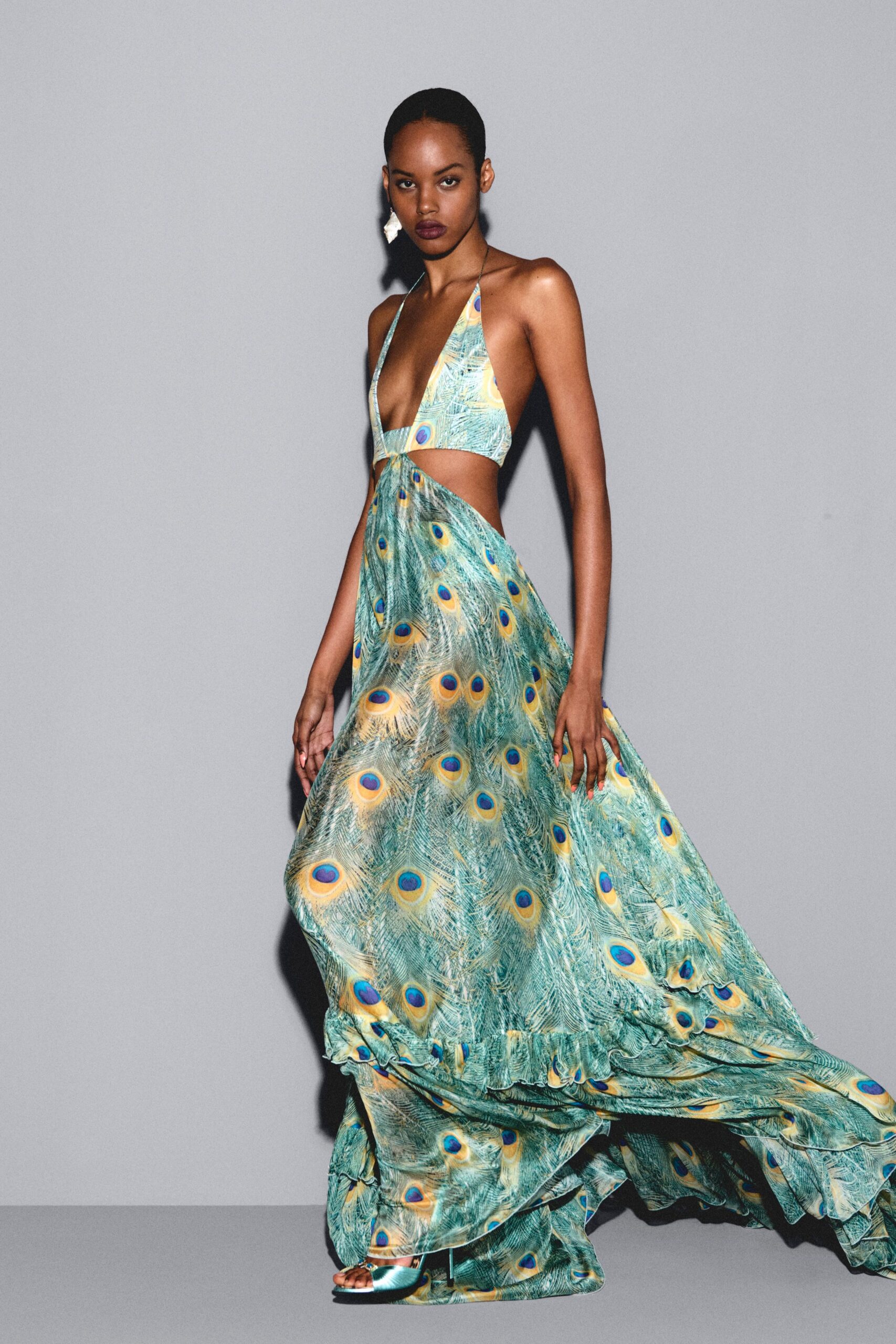 blue silk sleeveless v-neck fitted flared printed gown