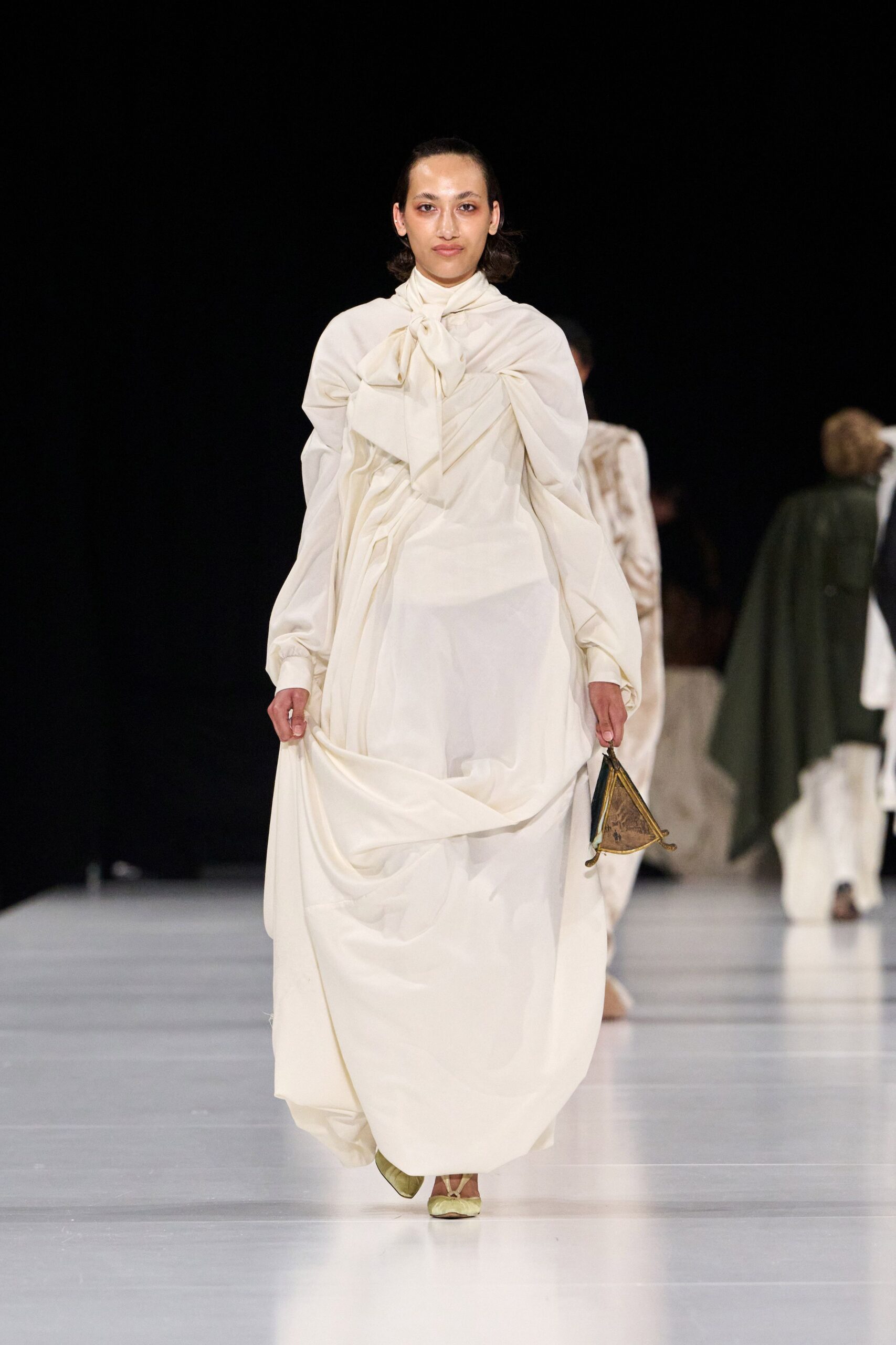 white silk long-sleeve high-neck fitted draped flowing dress